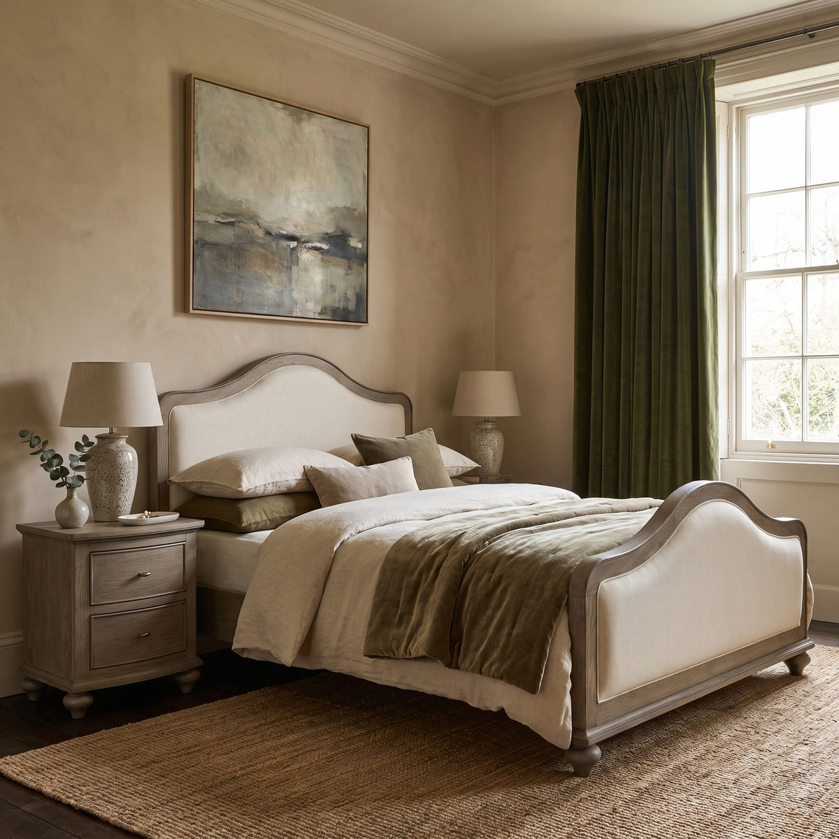 a bedroom with a bed and a lamp