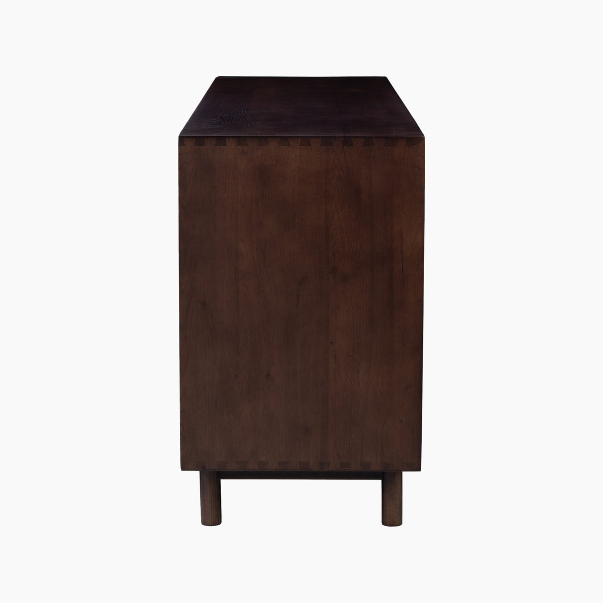 Side view of the Oslo 3 Door Sideboard with Shelves in Walnut, featuring dovetail joints and two short cylindrical legs, highlighting its elegant craftsmanship against a white background.
