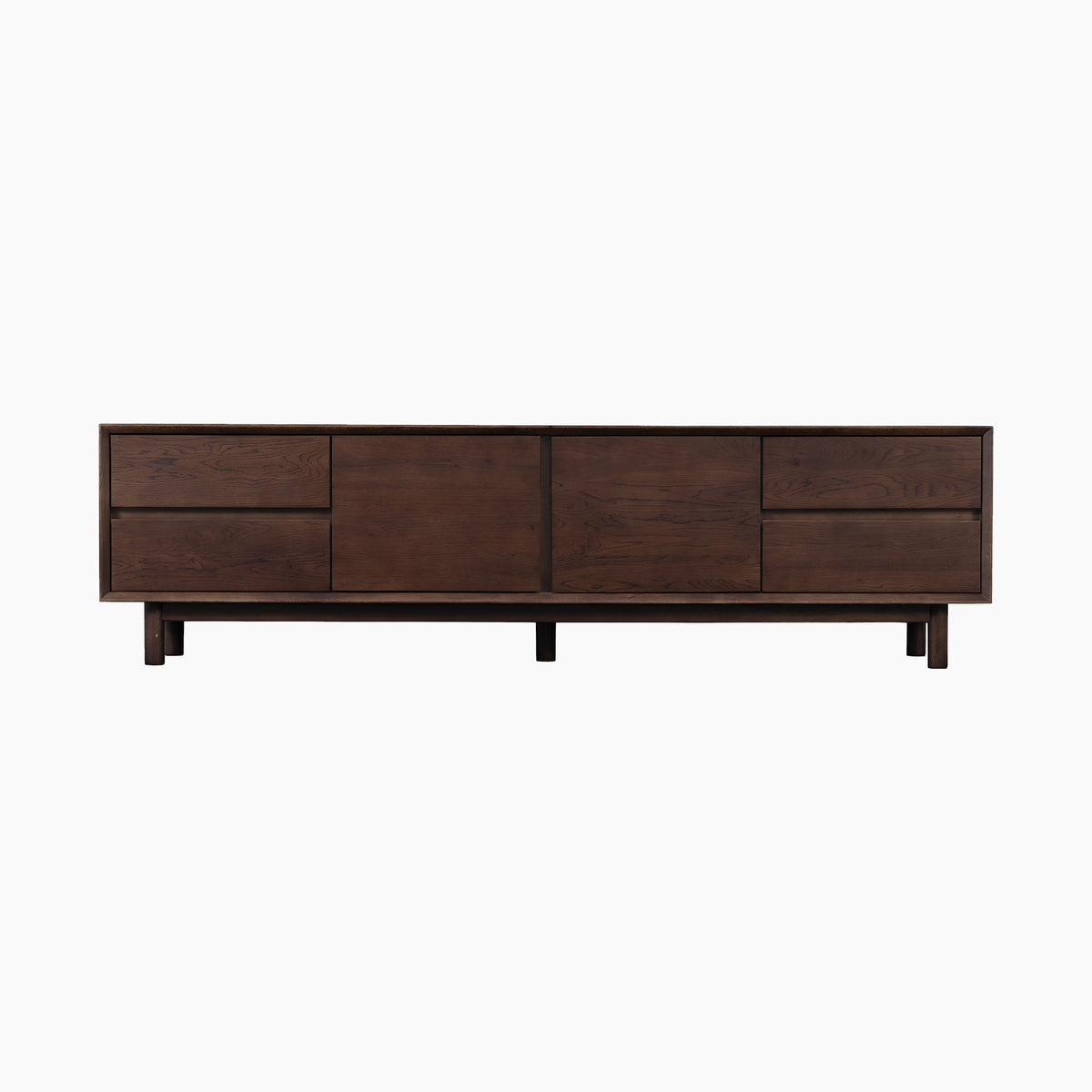 Introducing the Oslo TV Unit in Walnut: a solid wood TV stand with a rich walnut finish, inspired by contemporary Scandinavian design. Featuring two central doors, two drawers on the left, and one drawer on the right, this stylish piece is perfect for organized and elegant living rooms.