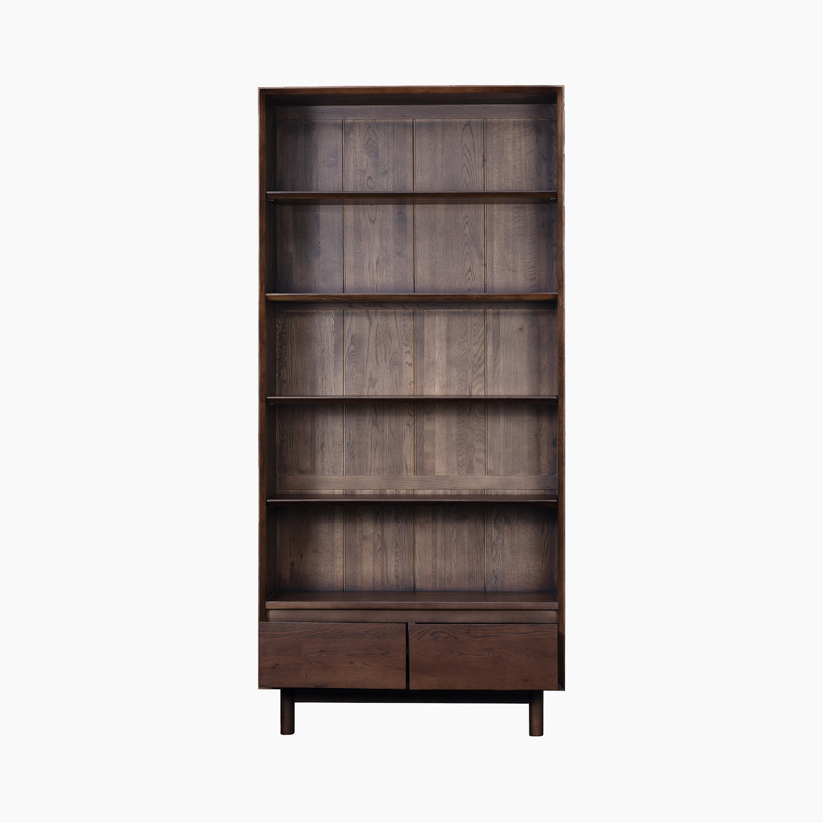 Oslo Bookcase in Walnut featuring five shelves and two bottom drawers, crafted from solid wood and displayed against a plain white background.
