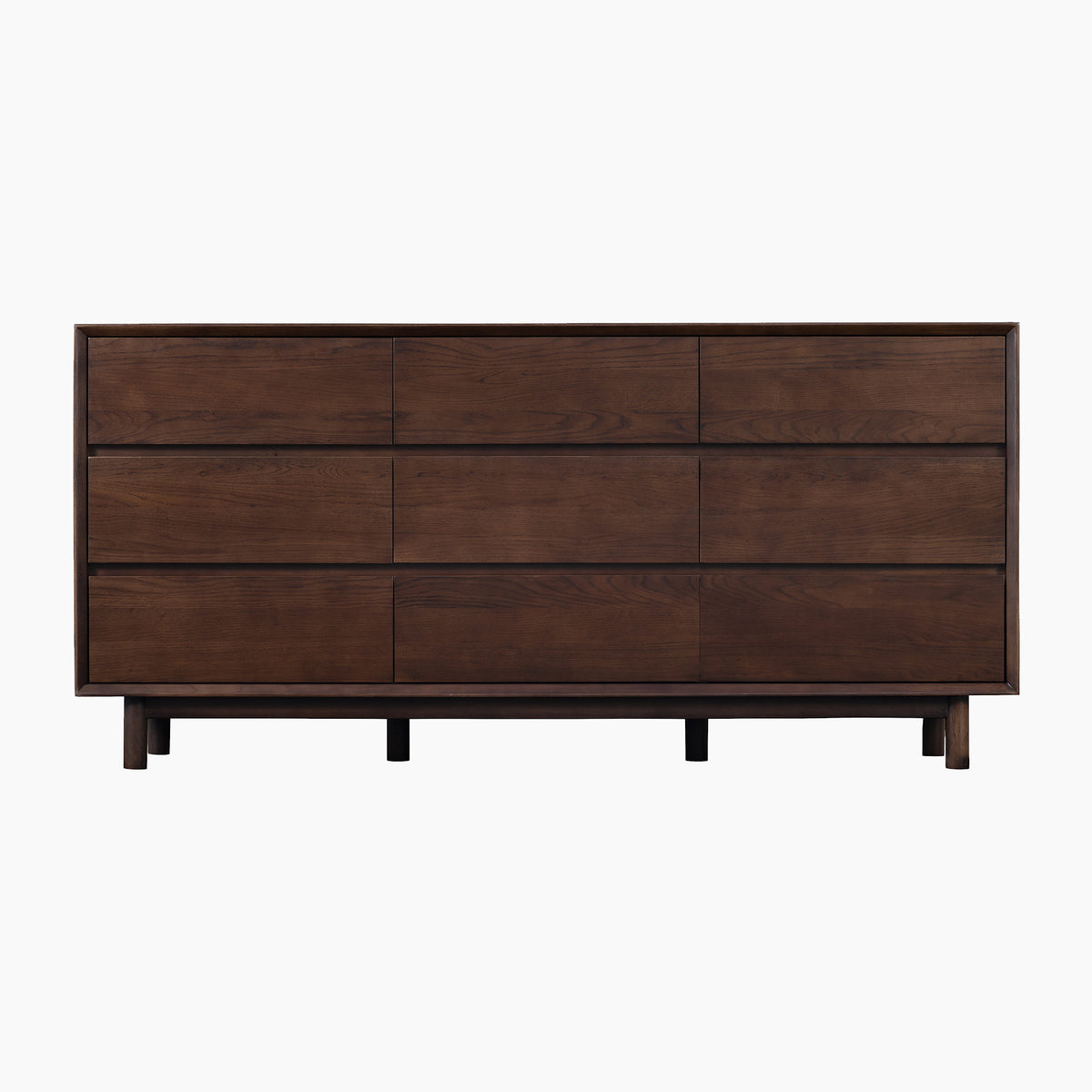 The Oslo 9 Drawer Chest in Walnut features a minimalist design with sleek lines, nine spacious drawers, and short legs, all finished in a refined walnut tone. Set against a white background, this elegant chest evokes the timeless appeal of solid oak bedroom furniture.