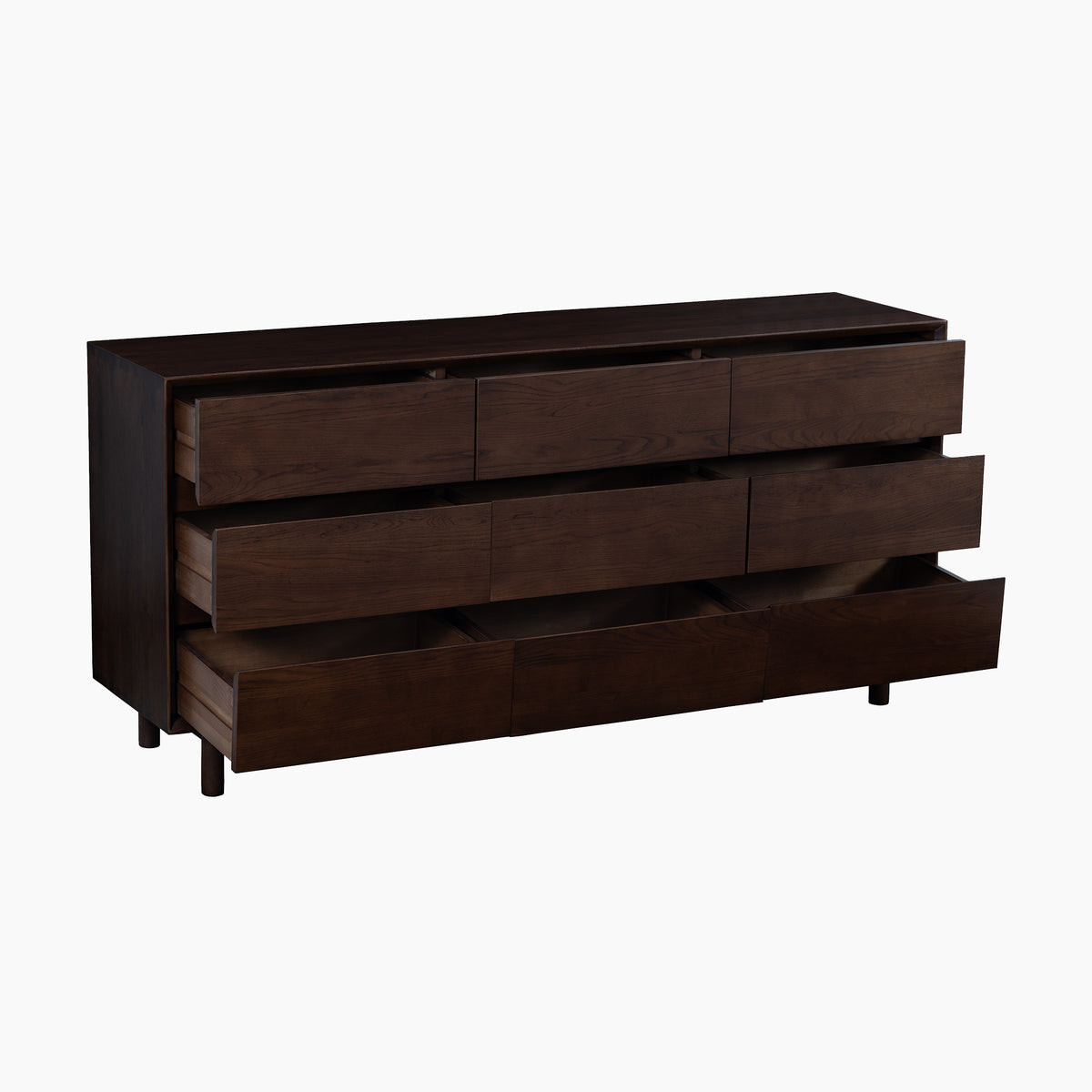 The Oslo 9 Drawer Chest in Walnut, crafted with a rich walnut finish, features nine spacious drawers—three partially open here—set against a white background. This elegant piece combines ample storage with the timeless appeal of solid oak bedroom furniture.