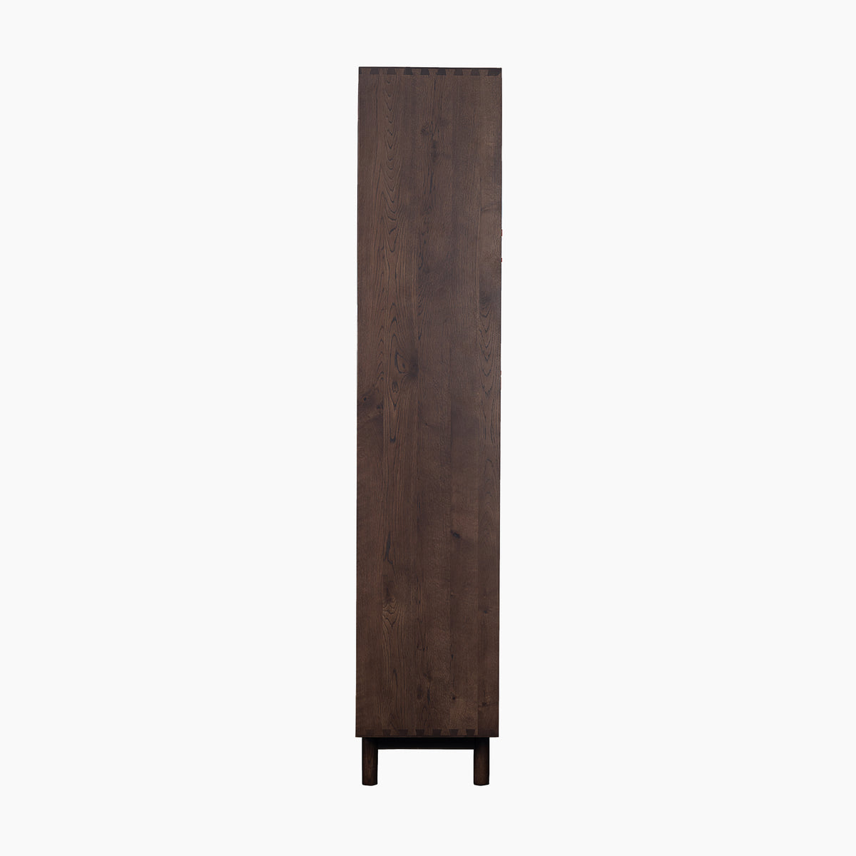 Tall, narrow Oslo Display Cabinet in Walnut, standing upright on two legs and viewed from the side against a white background.