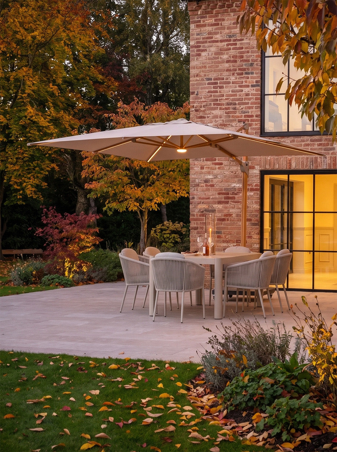 a patio with a table and chairs under an umbrella