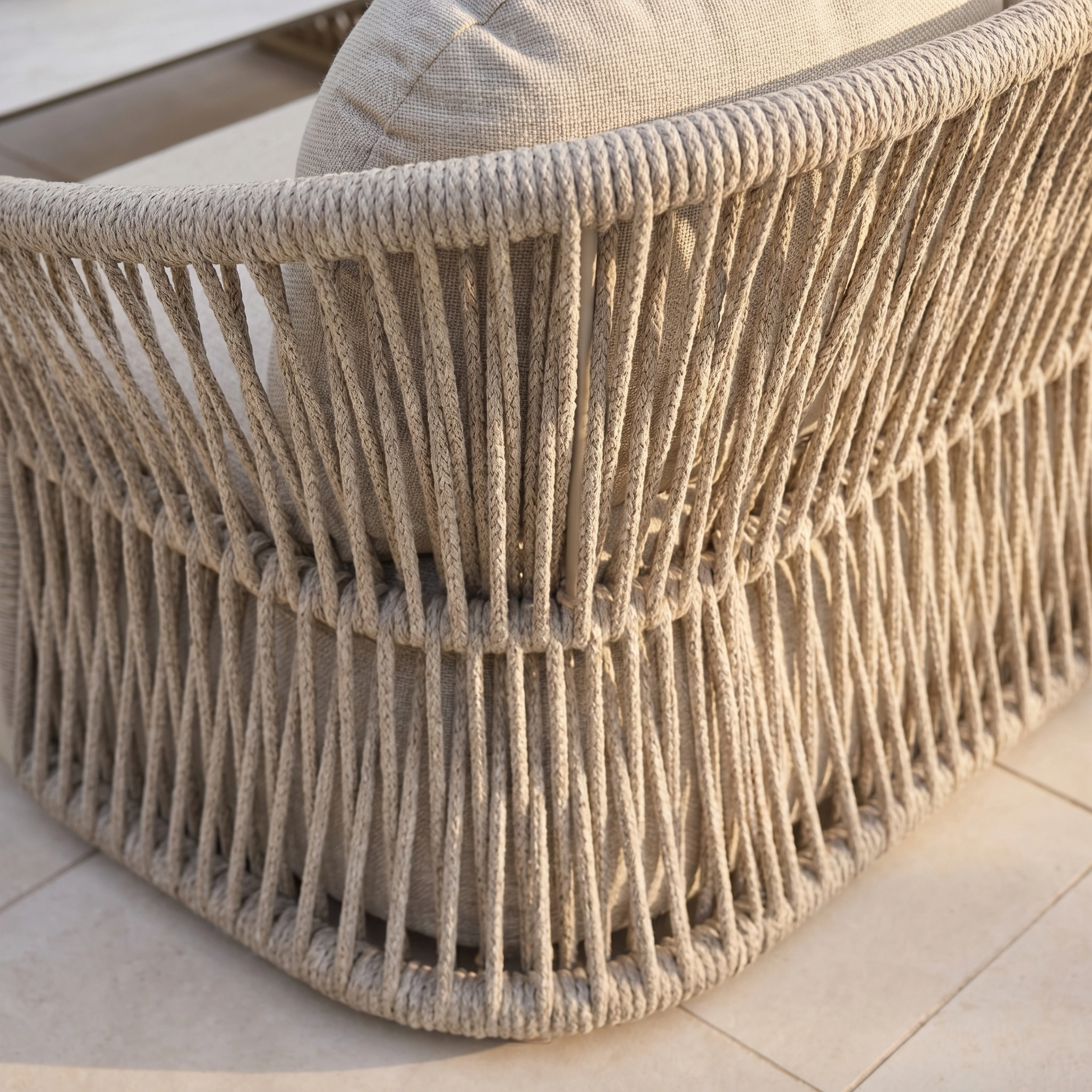 Close-up of the Pello 3 Seat Sofa Set in Fawn with quick dry cushions on a tiled patio.