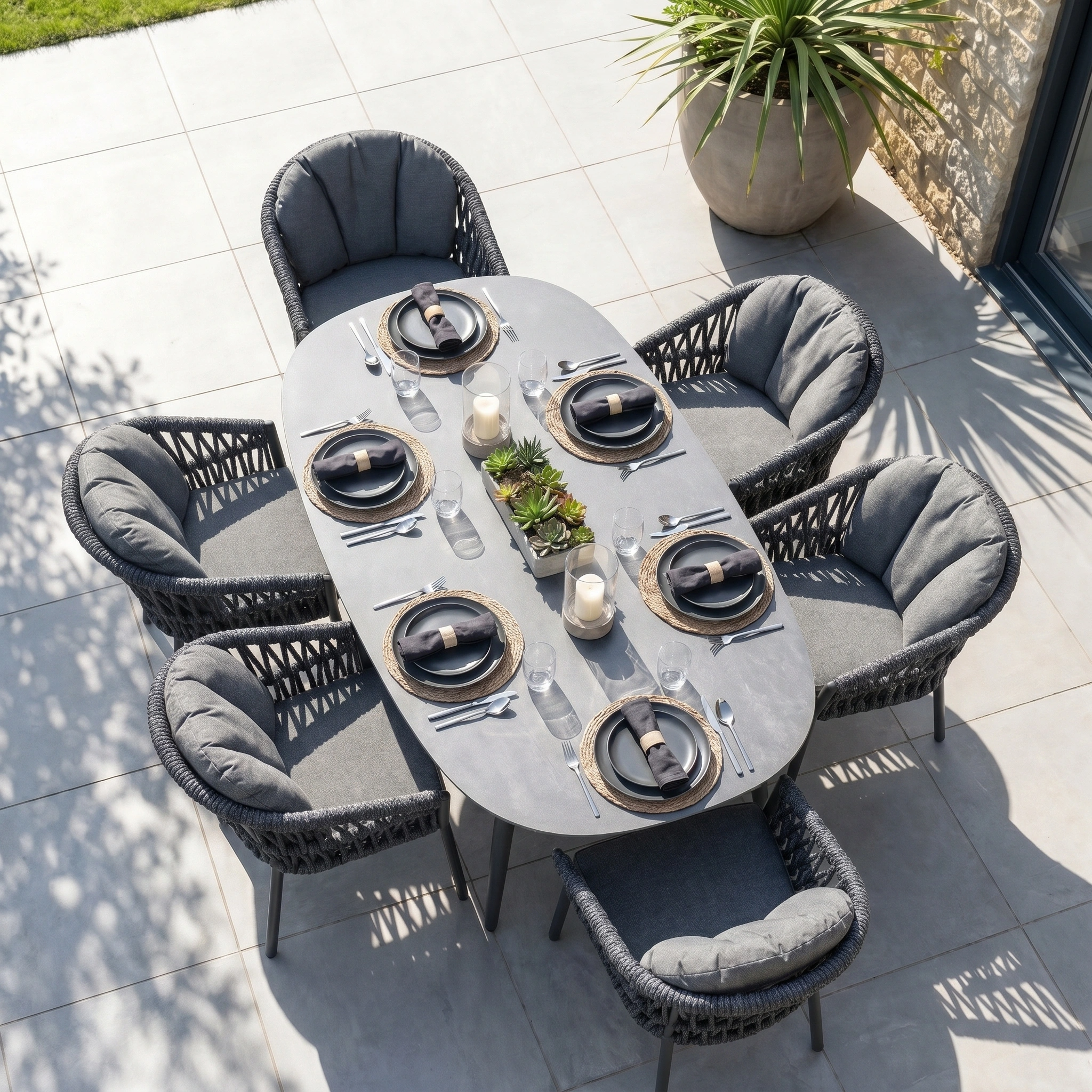 The Pello 6 Seat Oval Dining Set with Ceramic Table in Grey features stylish chairs—ideal for elegant outdoor dining. Perfect for patios, this garden furniture enhances any gathering with a modern look and comfortable seating.
