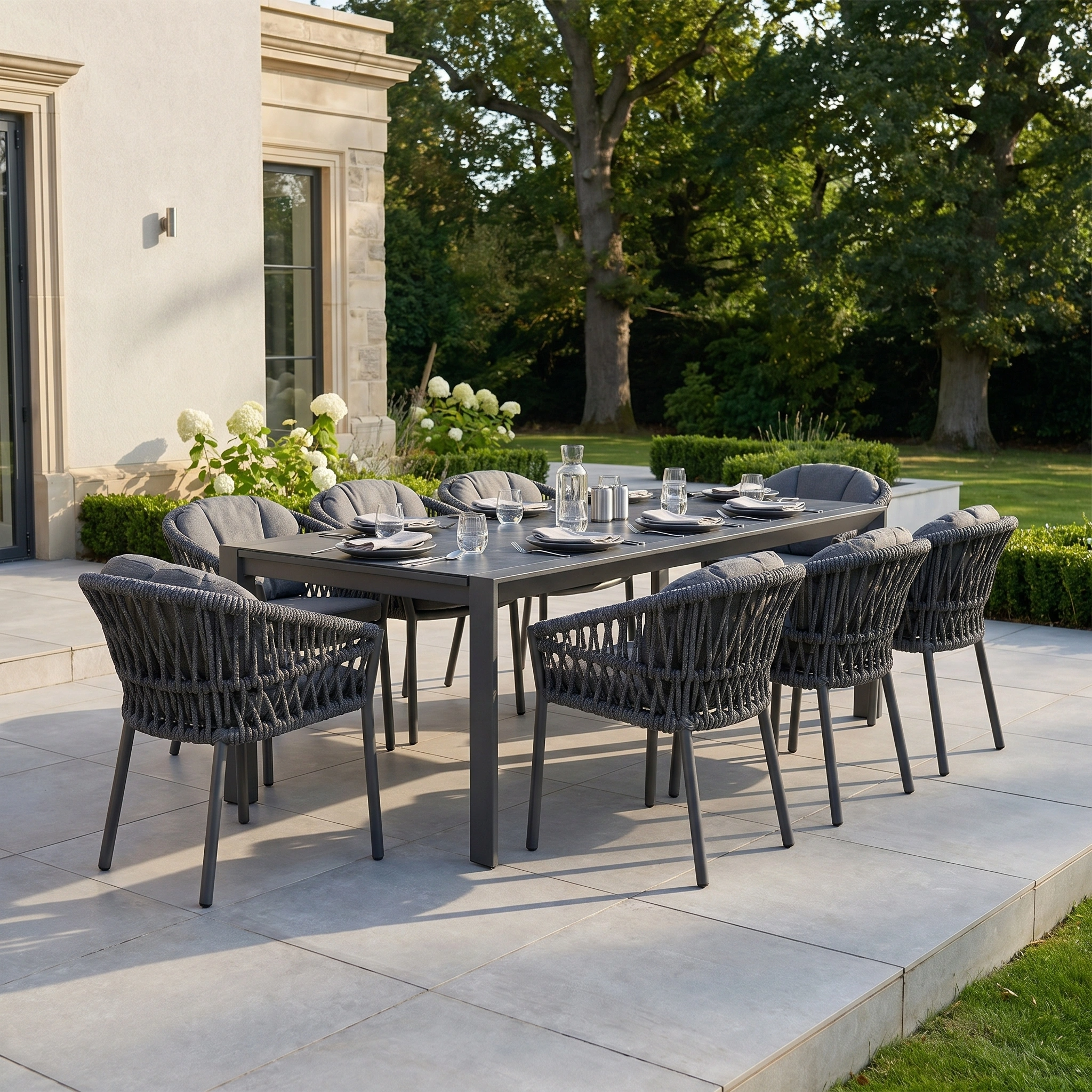 The Pello 8 Seat Extending Dining Set with Ceramic Table in Grey offers weather-resistant style, perfect for outdoor gatherings. Seats 8 for meals on the patio beside the garden, combining modern design and durability.