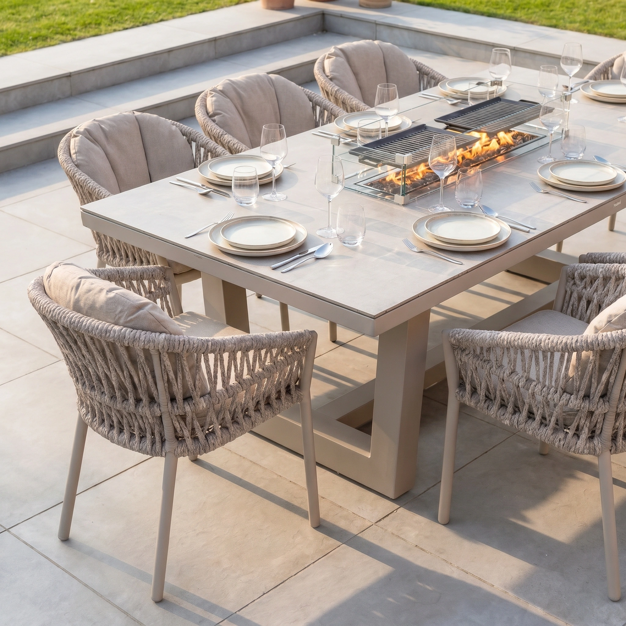 The Pello 8 Seat Rectangular Ceramic Firepit Dining Set in Fawn is a modern, weather-resistant outdoor dining set with a built-in fire feature, perfect for patios or yards.