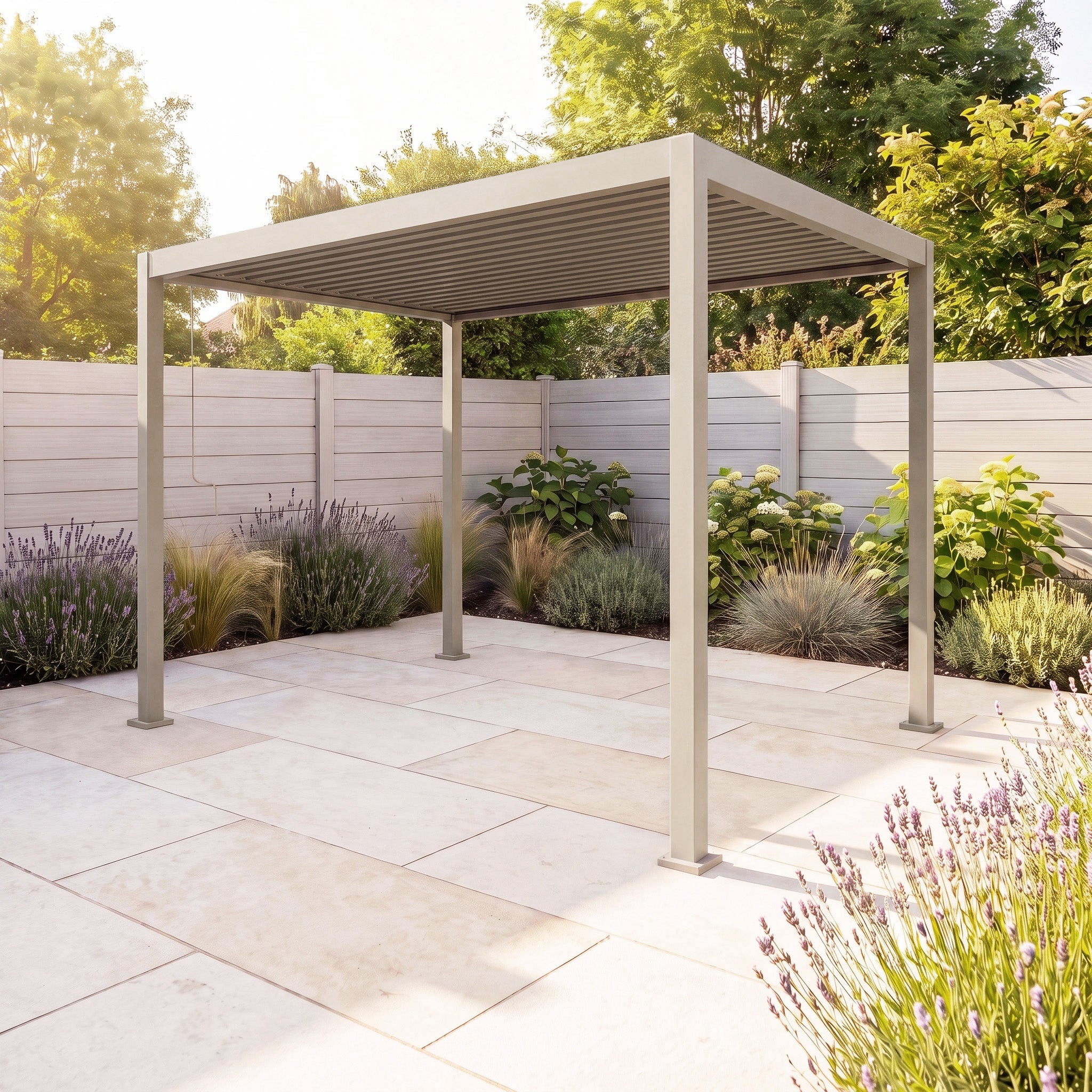 PergoSTET Lite 2.4m x 3m Metal Rectangular Pergola in Latte installed on a tiled patio, featuring tilting louvres for customizable shade, surrounded by lush plants and a wooden privacy fence in a sunlit backyard—an inviting outdoor retreat perfect for relaxation and entertaining.