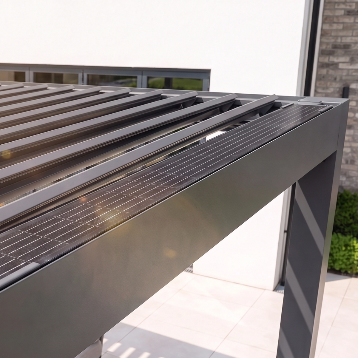 Close-up of the PergoSTET Lite 3m x 4m Metal Rectangular Pergola in Grey, featuring sleek motorised louvres and integrated LED lighting on a sunny patio.
