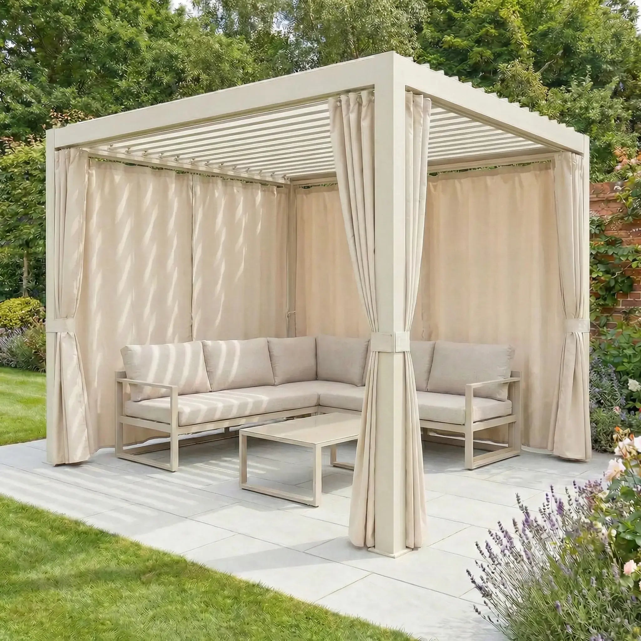 Lite 2.4m x 3m pergola in Latte with PergoSTET Side Curtains, a cushioned corner sofa, and coffee table on a tiled patio in the garden.