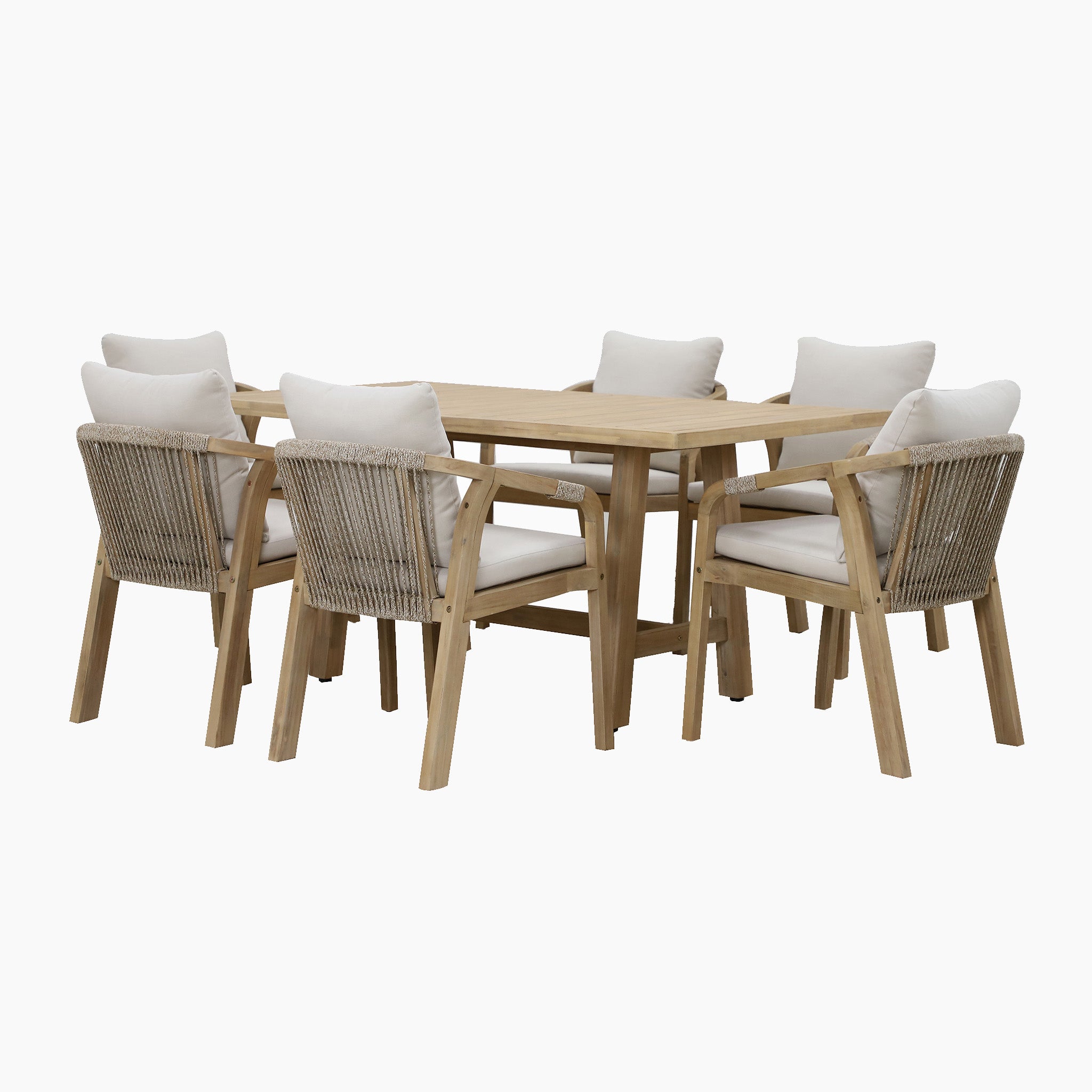The Quay 6 Seat Rectangular Dining Set in Linen, crafted from sustainably sourced acacia wood, includes a wooden dining table with six matching chairs that feature woven backs and white cushions, all arranged on a white background.