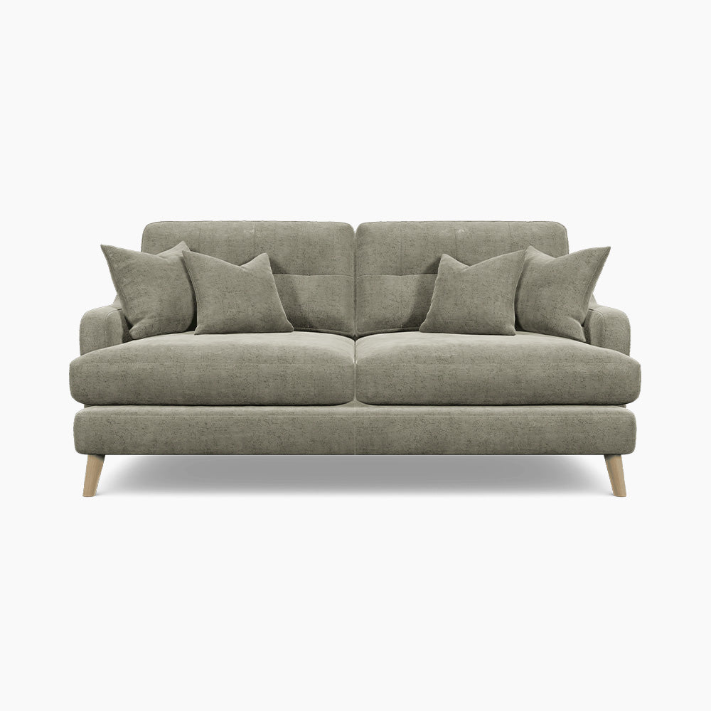 a grey couch with pillows