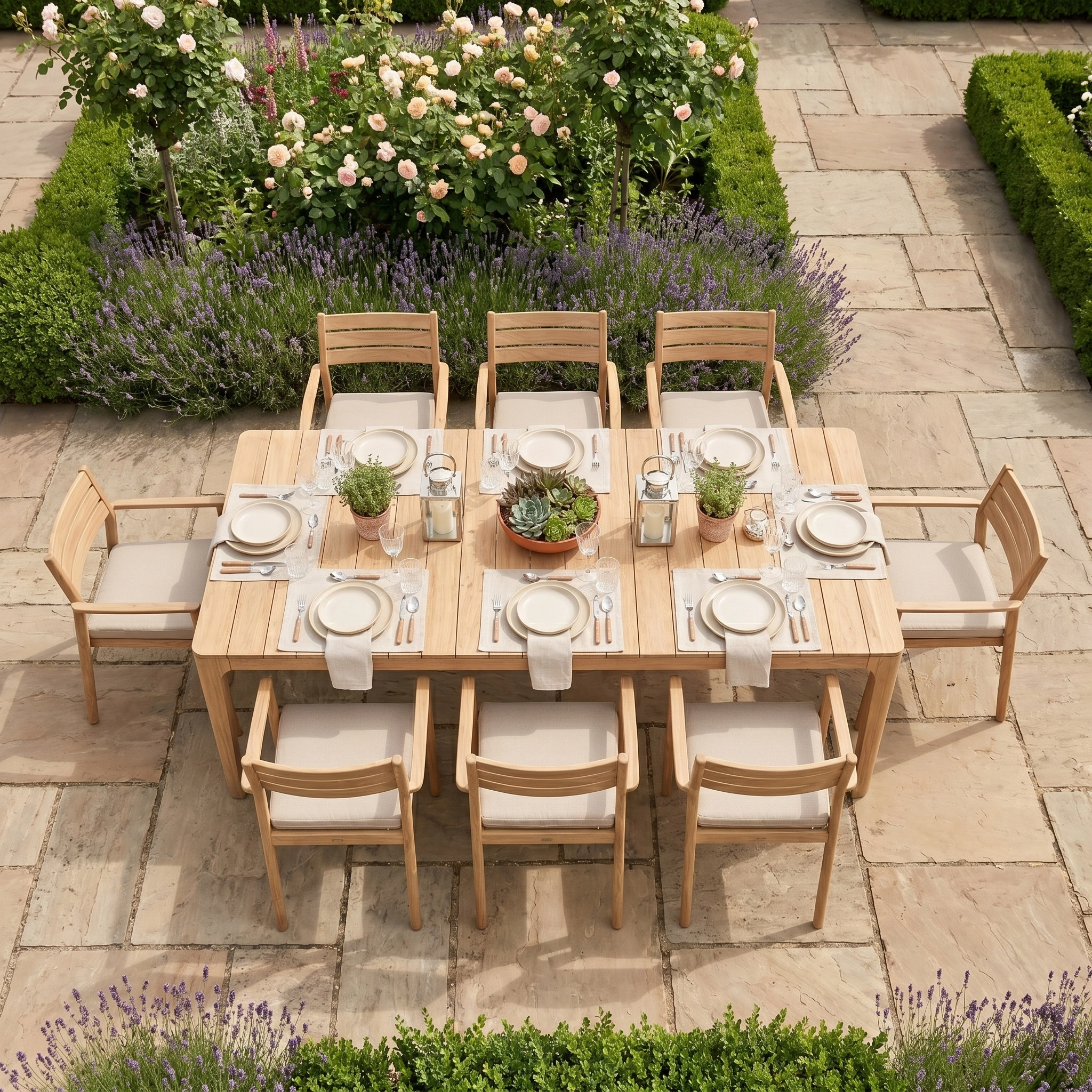 The Siena 8 Seat Dining Set with Teak Table in Fawn is beautifully arranged in a garden, surrounded by roses and lavender.