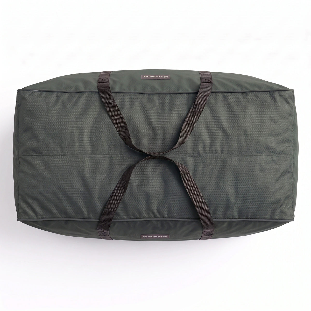 The Stormtex Cushion Storage Bag, measuring 145 x 100 x 100 cm, is a large dark green storage bag with black handles shown from above against a white background.