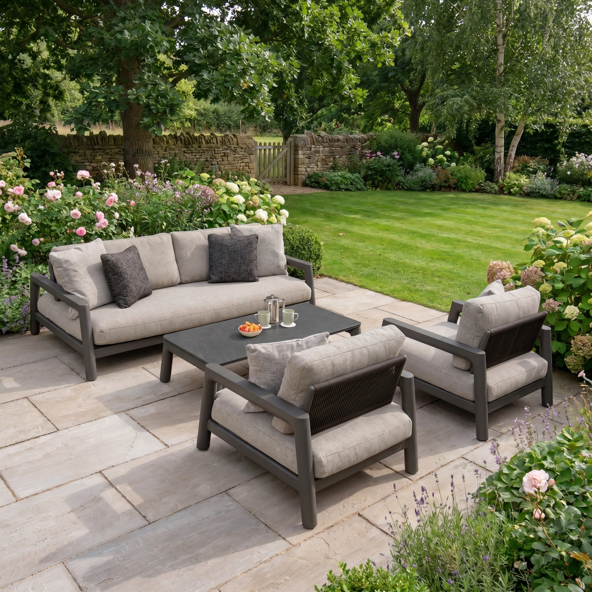 Theia 3 Seat Sofa Set in Truffle: a modern grey modular outdoor set with aluminium sofa, chairs, and coffee table—ideal for patio relaxation.