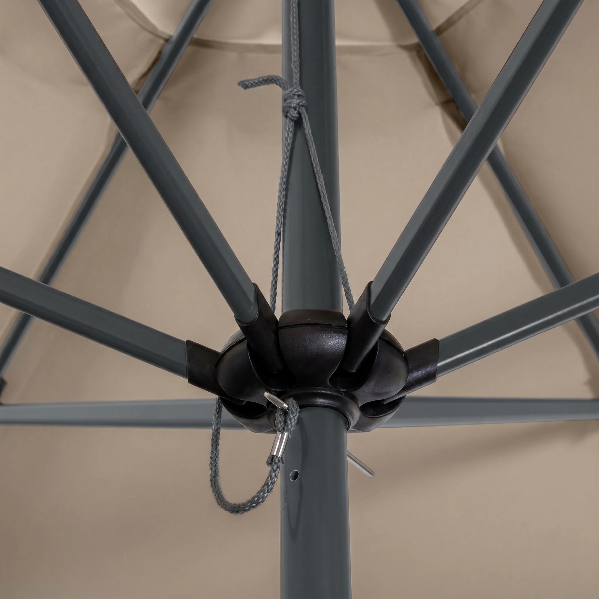 Close-up of the Triton 2.5m Round Aluminium Parasol in Khaki, showing its sturdy support ribs and central pole mechanism. This fade-resistant garden parasol is designed for durability and reliable outdoor shade.