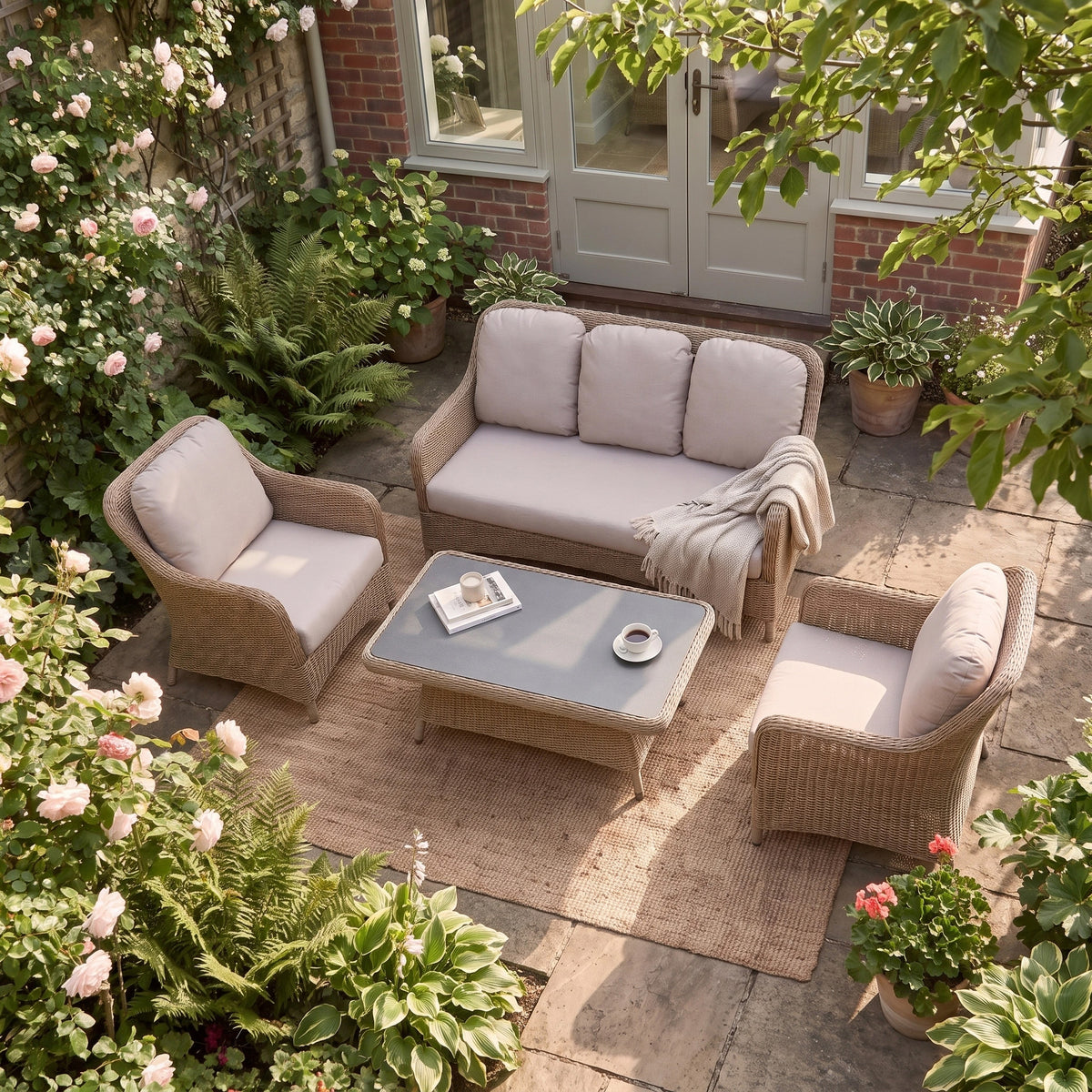 a patio area with furniture and plants