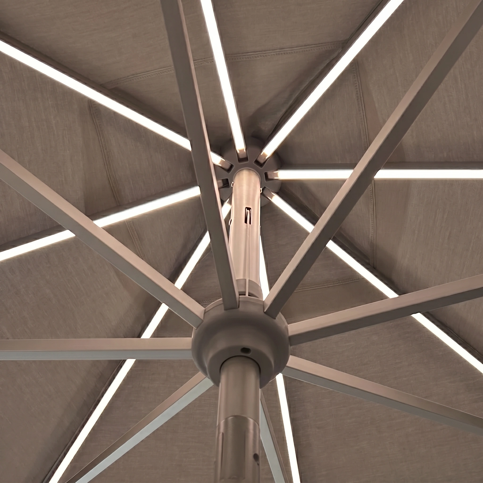 Close-up view of the underside of the Zelos 3m Round Parasol with LED Lighting in Taupe, showcasing its metal spokes and integrated LEDs for a stylish outdoor ambiance.