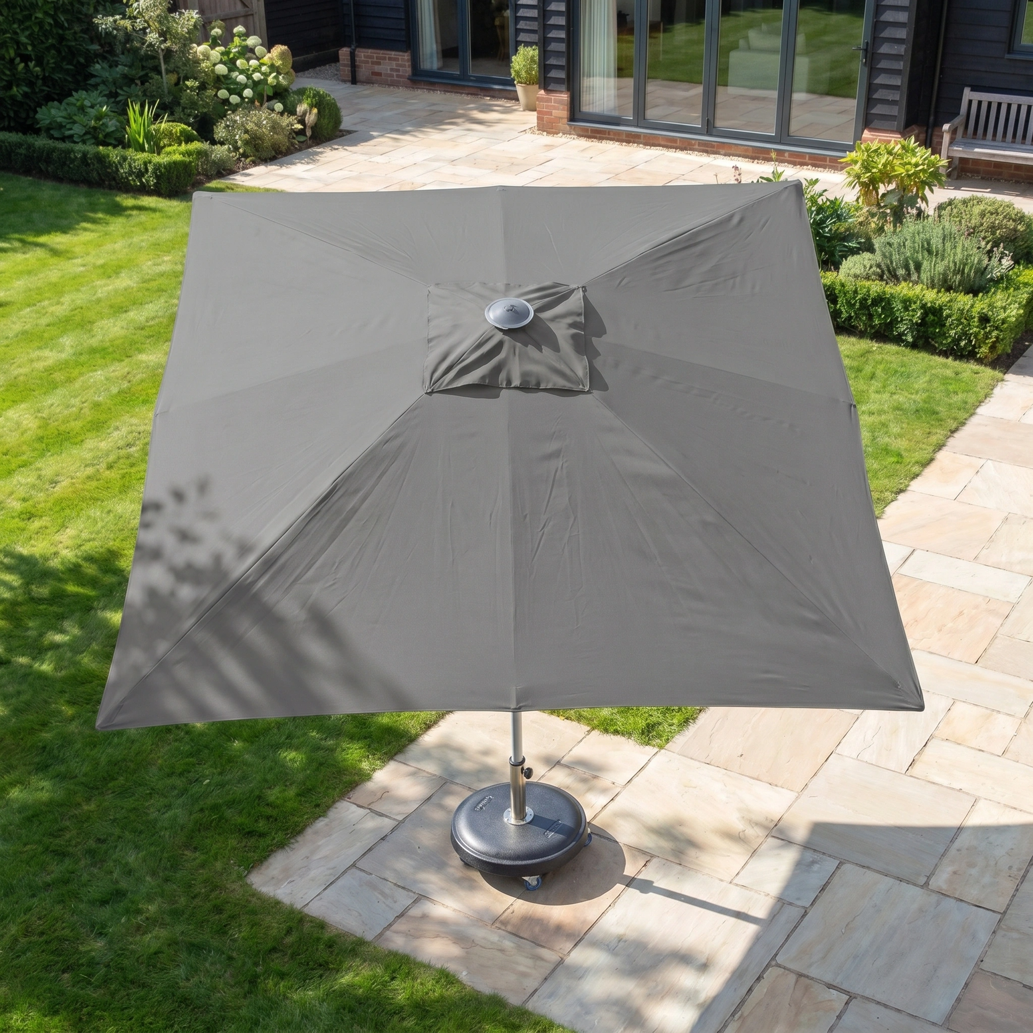 The Zelos 2.5m Square Parasol with LED Lighting in Grey provides ample UV protection for your garden or terrace, combining modern style and practical shade for outdoor comfort.