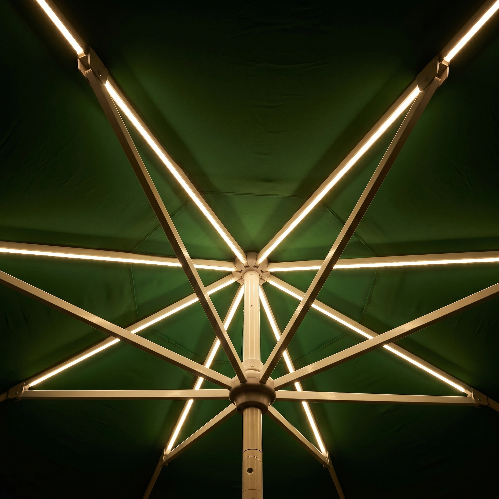 Relax under the Zelos 3m Round Parasol with LED Lighting in Green—its sturdy metal frame offers UV protection and gentle shade, while built-in lights add a warm evening glow.