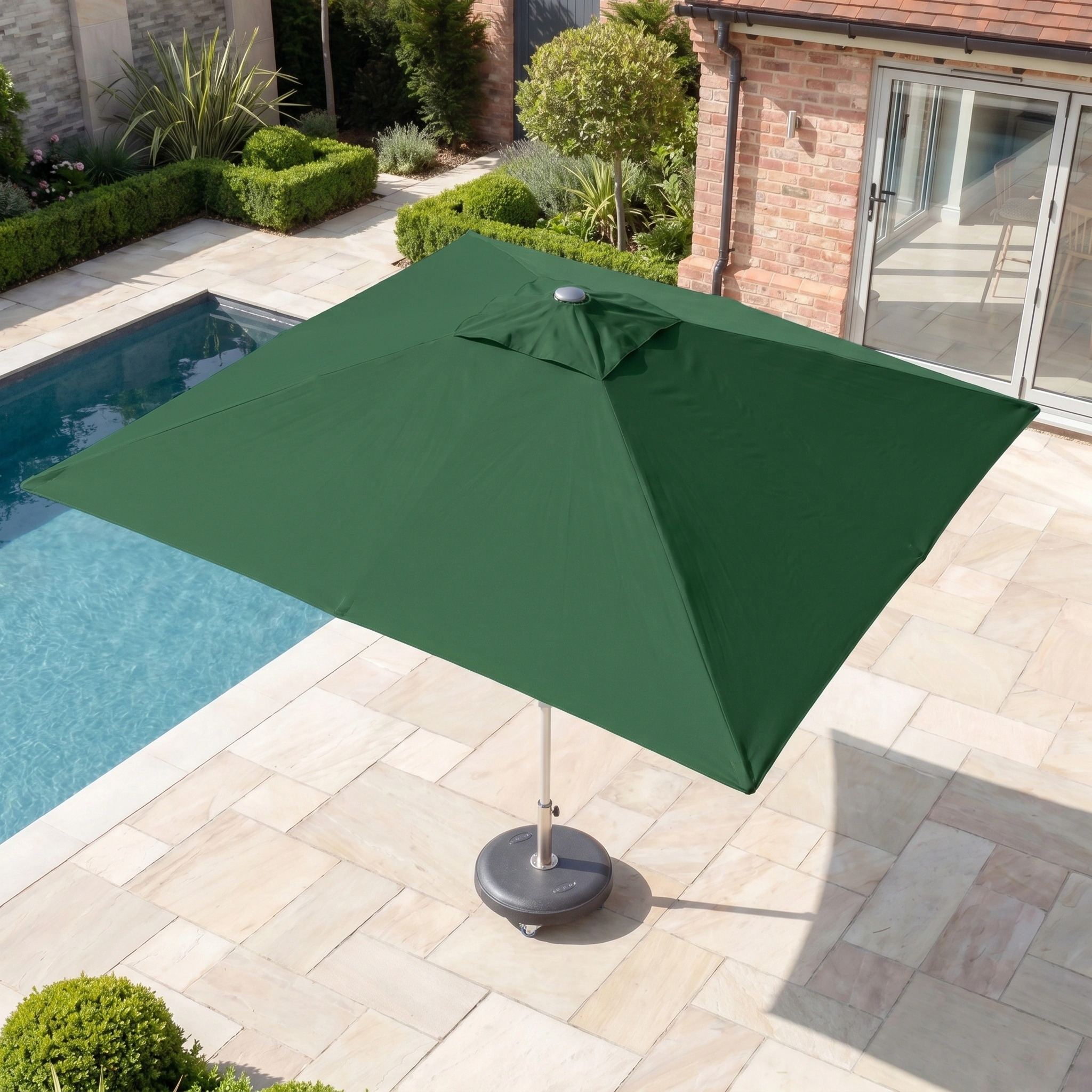 The Zelos 3m x 2m Rectangular Parasol with LED Lighting in Green offers stylish shade and dependable UV protection for your poolside terrace, perfect for relaxing by the swimming pool and garden shrubs.