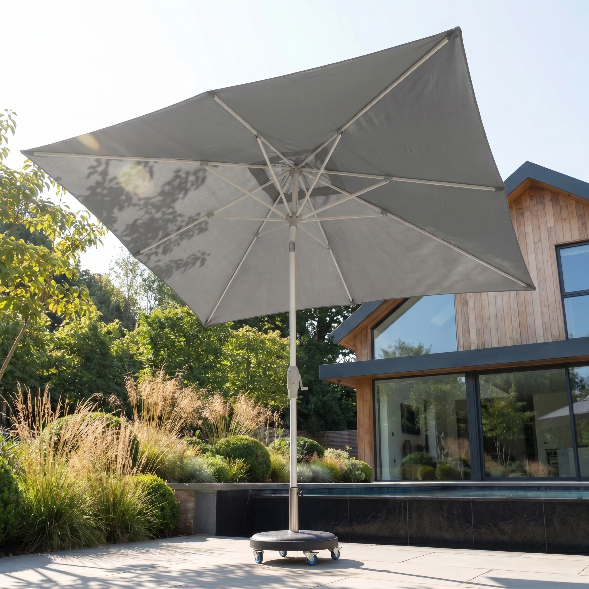 The Zelos 3m x 2m Rectangular Parasol with LED Lighting in Grey provides excellent UV protection for your poolside terrace, blending modern style and practicality for outdoor spaces.