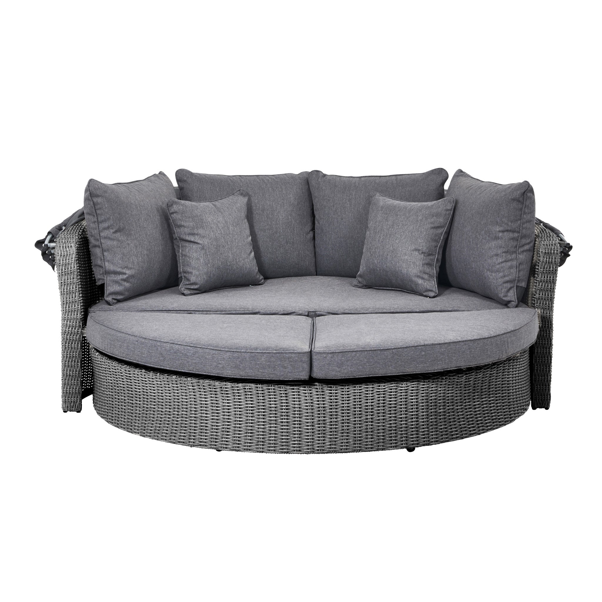 The Pacific Lifestyle Bermuda Daybed in Slate Grey is a round wicker sofa with gray cushions and four small pillows. Its space-saving design fits outdoor settings perfectly, and it's weatherproof for enhanced durability.