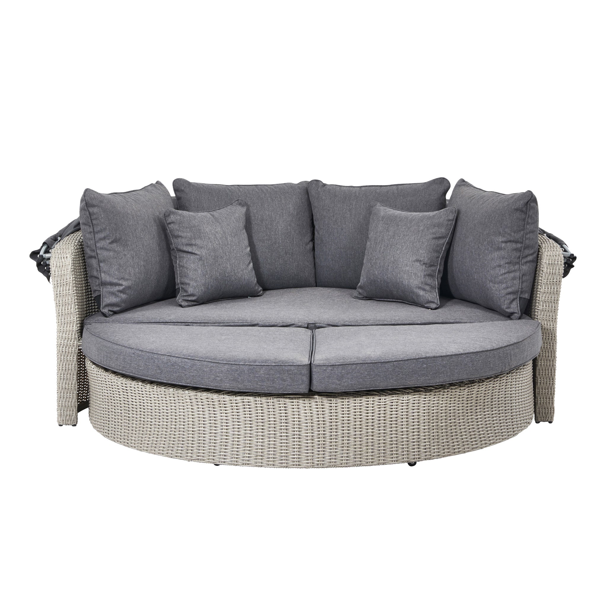 The Pacific Lifestyle - Bermuda Daybed in Stone Grey is a round wicker sofa featuring woven-textured gray cushions and pillows. Made from weatherproof material, it's ideal for outdoor lounging.