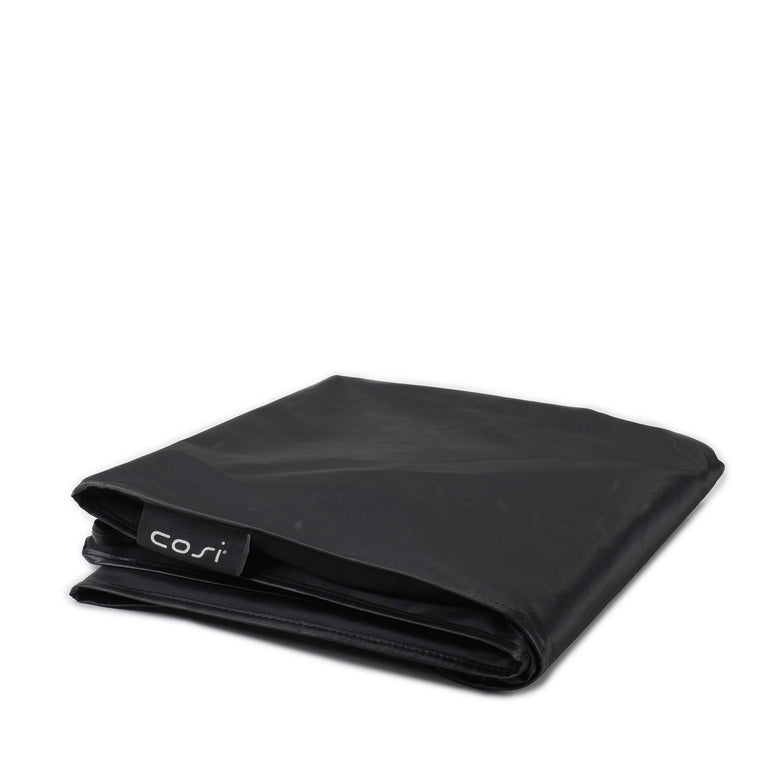The Cosi - Cosiloft 120 Lounge All Weather Protection Cover, featuring a "cosi" tag on one edge, is folded for display on a plain white background.