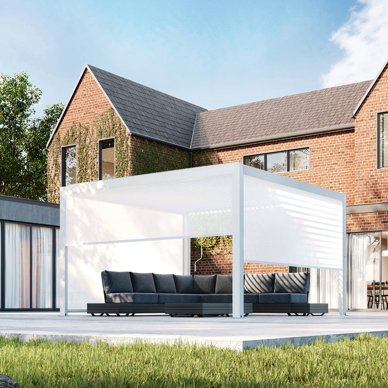 A modern brick house featuring a PergoSTET Plus 4m x 4m Square Pergola with 3 Drop Sides and LED Lighting in White and outdoor seating basks in the sunshine.