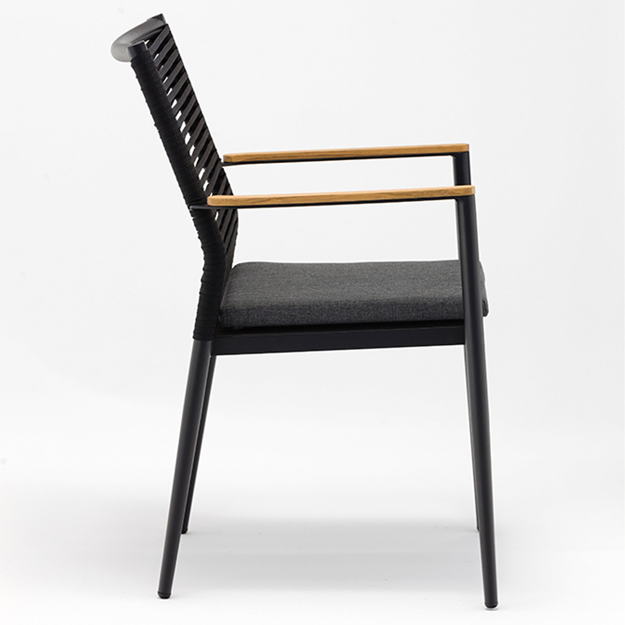A modern chair with a black frame, woven backrest, wooden armrests, and a dark grey cushion on a white background. This sleek design pairs perfectly with the Portland 4 Seat Round Dining Set featuring flat rope weaved armchairs and a teak table in charcoal for a cohesive look.