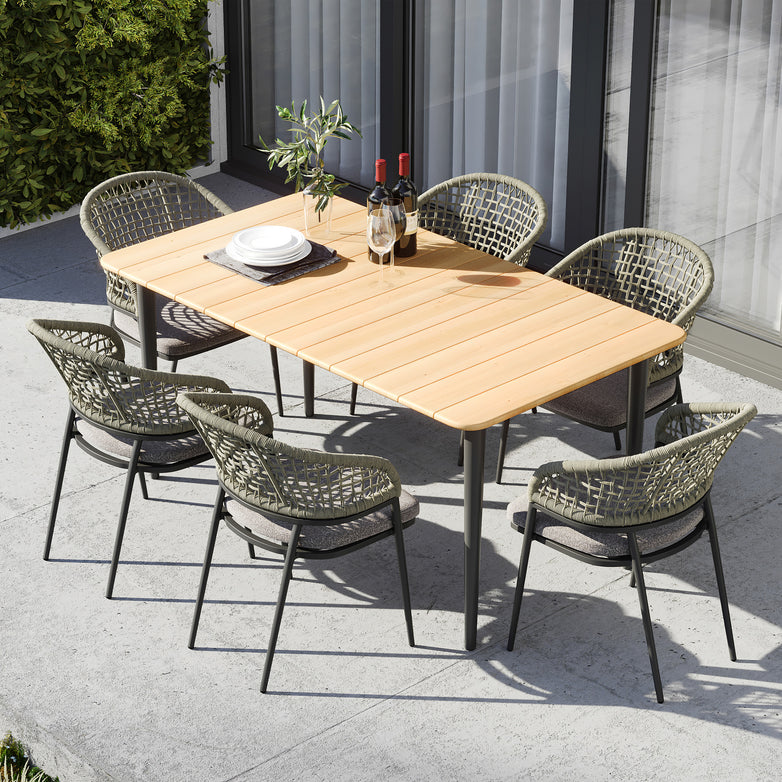 The Kalama 6 Seat Rectangular Dining Set in Olive Green features a weather-proof aluminium teak table and six woven chairs, perfect for outdoor dining with plates, cutlery, and wine bottles.