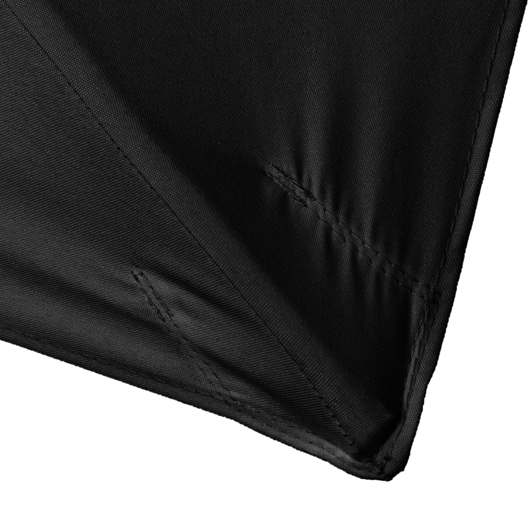 Corner of a black fabric with visible stitching and folds, reminiscent of the durable material used in a Kratos 3m x 2m Rectangular Wooden Parasol in Black, promising quality and attention to detail.