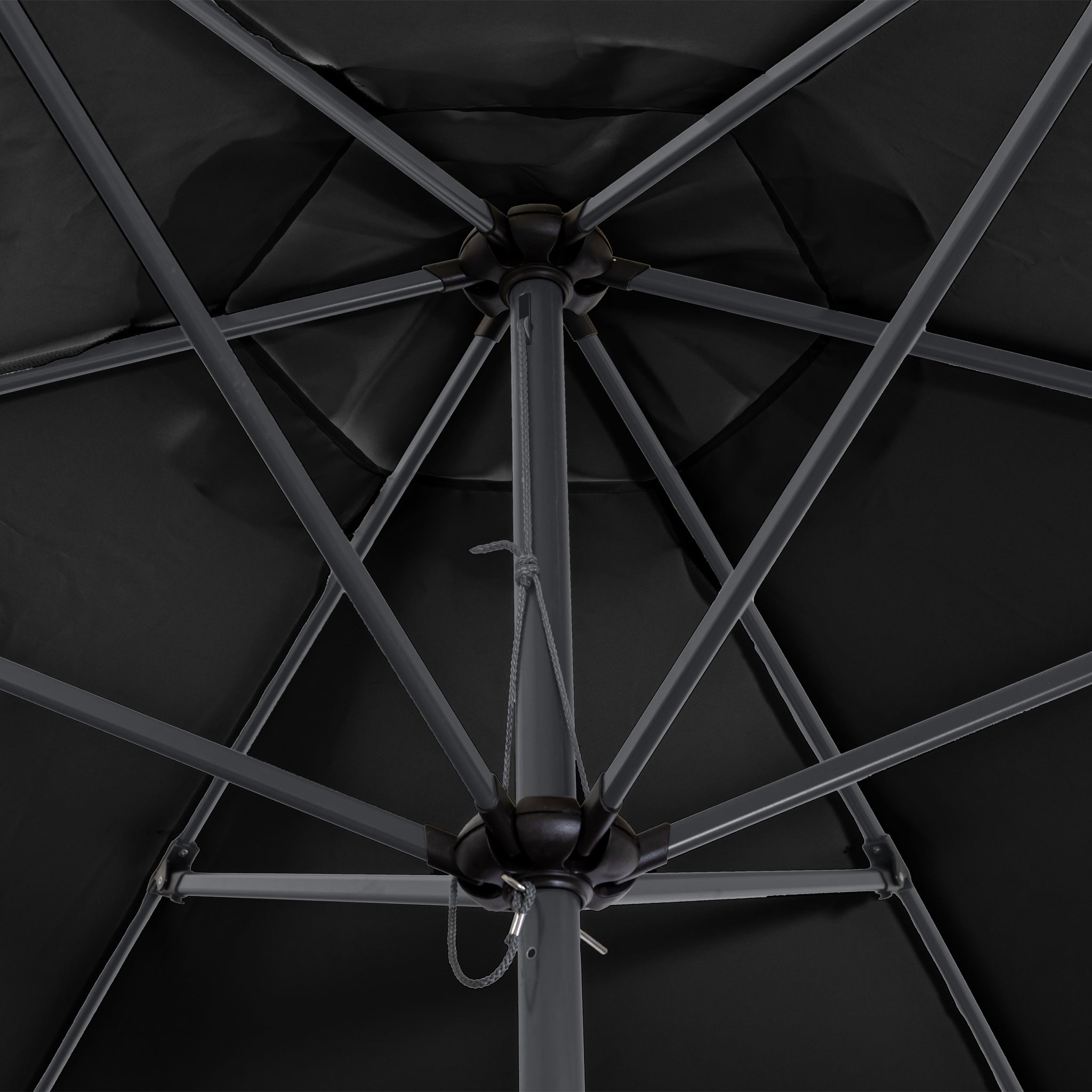 Close-up view of the underside of an open Triton 2.5m Round Aluminium Parasol in Black, showcasing its central pole and robust rib structure. This fade-resistant umbrella boasts a UV rating of 50+, ensuring both durability and maximum sun protection.