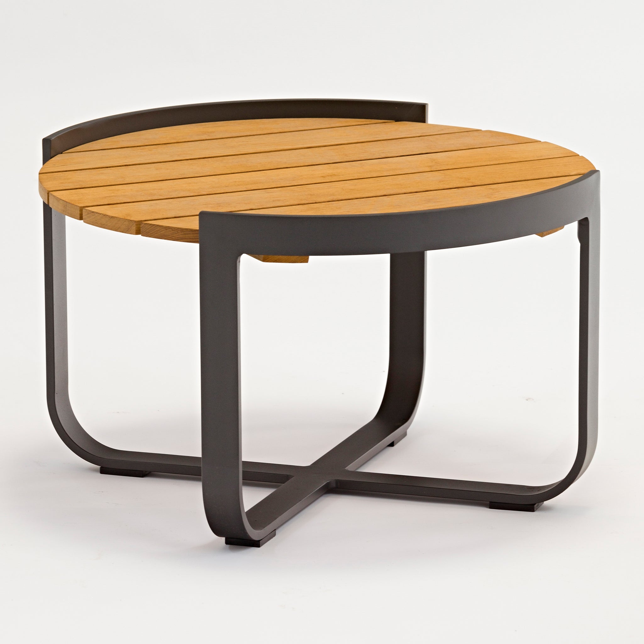 The Bloom Coffee Table with Teak Top in Charcoal features a round wooden teak top and a sturdy metal frame with curved legs, perfect for both indoor and outdoor furniture settings against a pristine white background.
