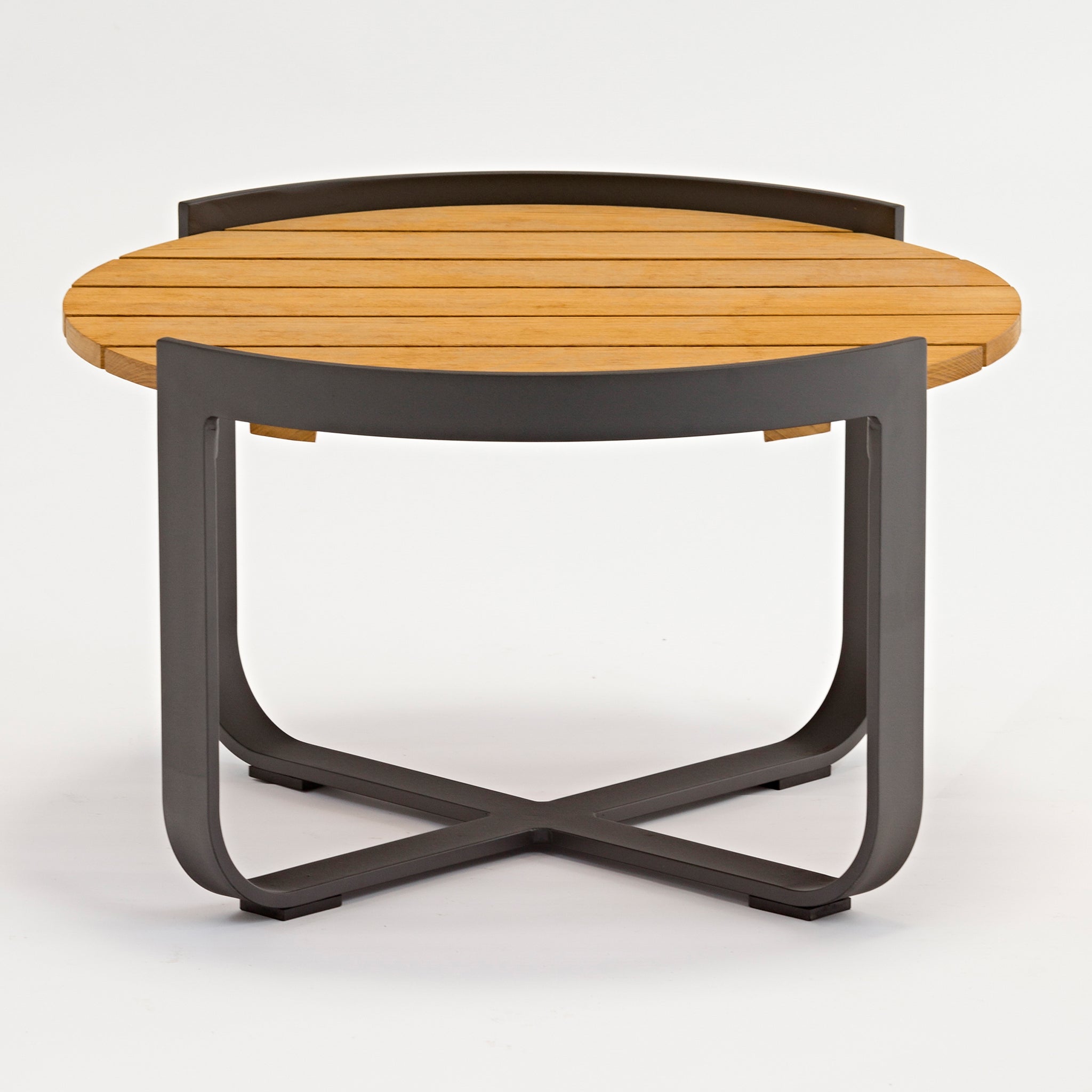 Introducing the Bloom Coffee Table with Teak Top in Charcoal, a modern round wooden coffee table featuring a sleek teak top and black metal frame with curved legs, perfect for both indoor and outdoor furniture settings. Displayed elegantly against a white background.
