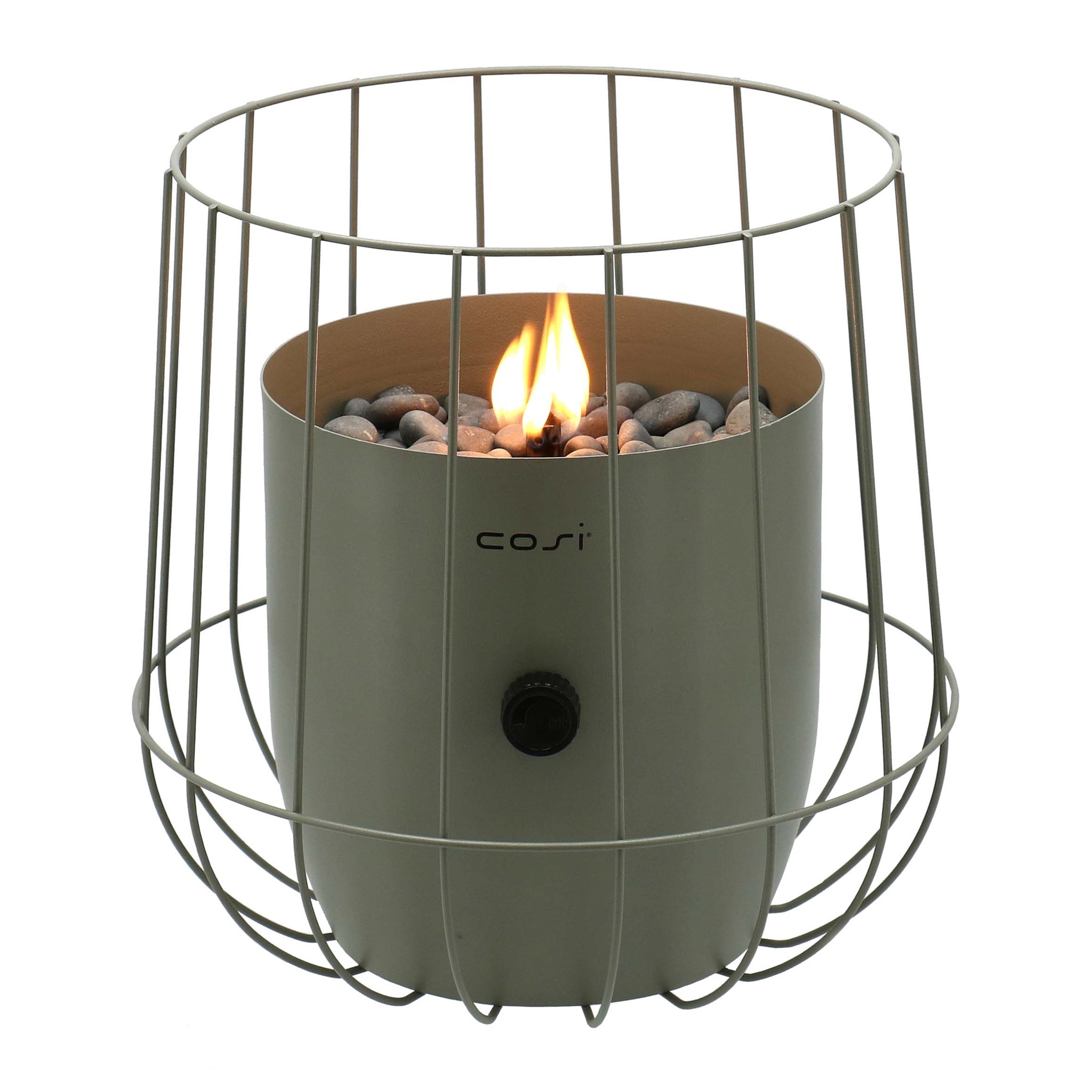 The Cosi - Cosiscoop Basket Lantern in Olive is a contemporary tabletop fire pit featuring a wire cage design reminiscent of basket lanterns, complete with pebbles and a small flame.