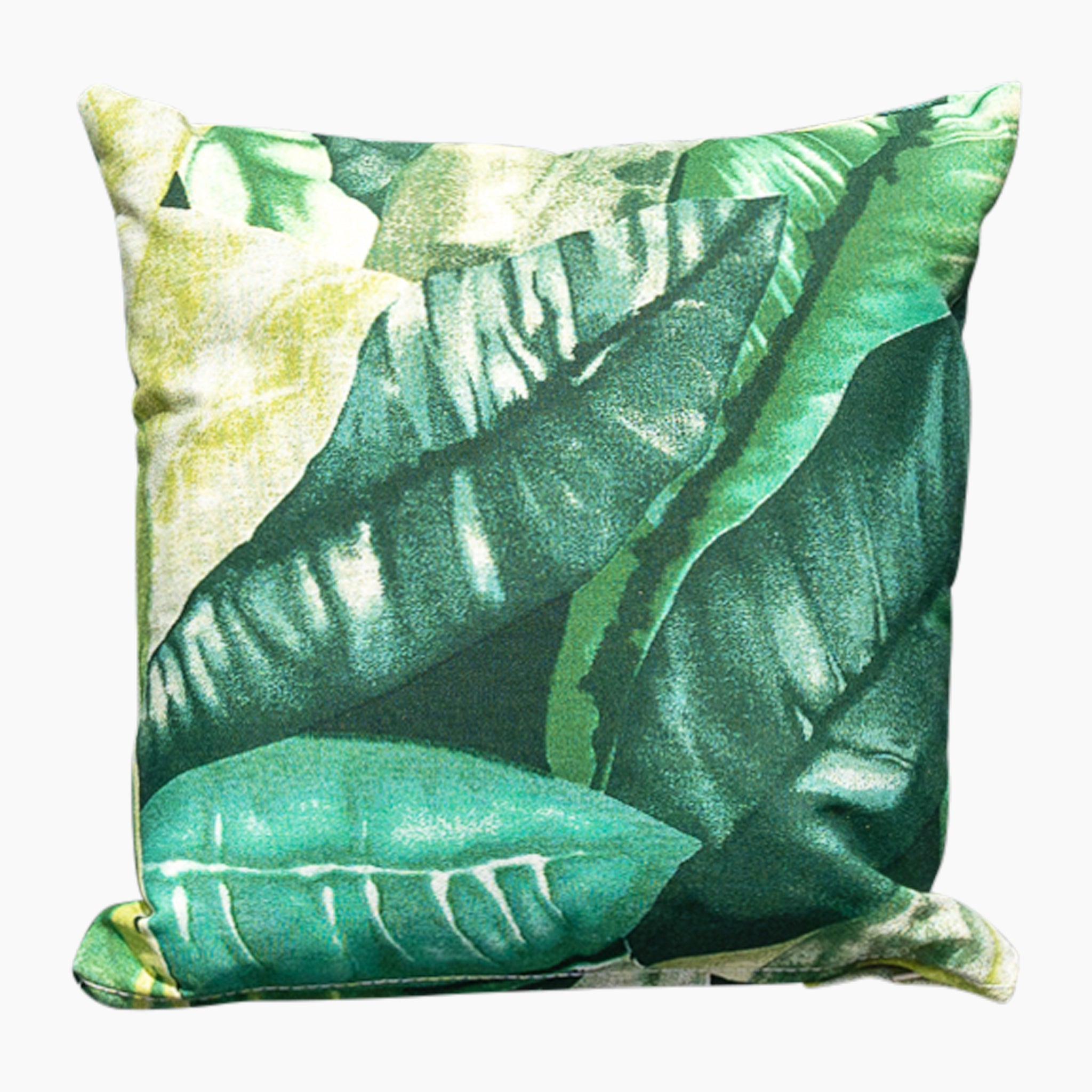 The Acrisol Amazonia Verde Small Scatter Cushion, measuring 25cm x 25cm, features a vibrant print of large, overlapping green tropical leaves. This square throw pillow is perfect for complementing your outdoor furniture set and is made from solution-dyed acrylic to ensure durability and vibrancy whether used as scatter cushions or standalone décor.