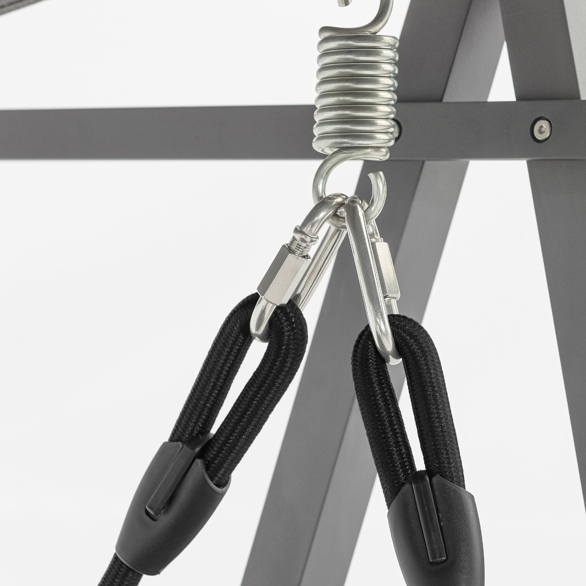 Close-up of a metal spring hook attached to the powder-coated aluminium frame of the Lima Aluminium Swing Seat in Washed Grey, holding two black cords with secure clips.