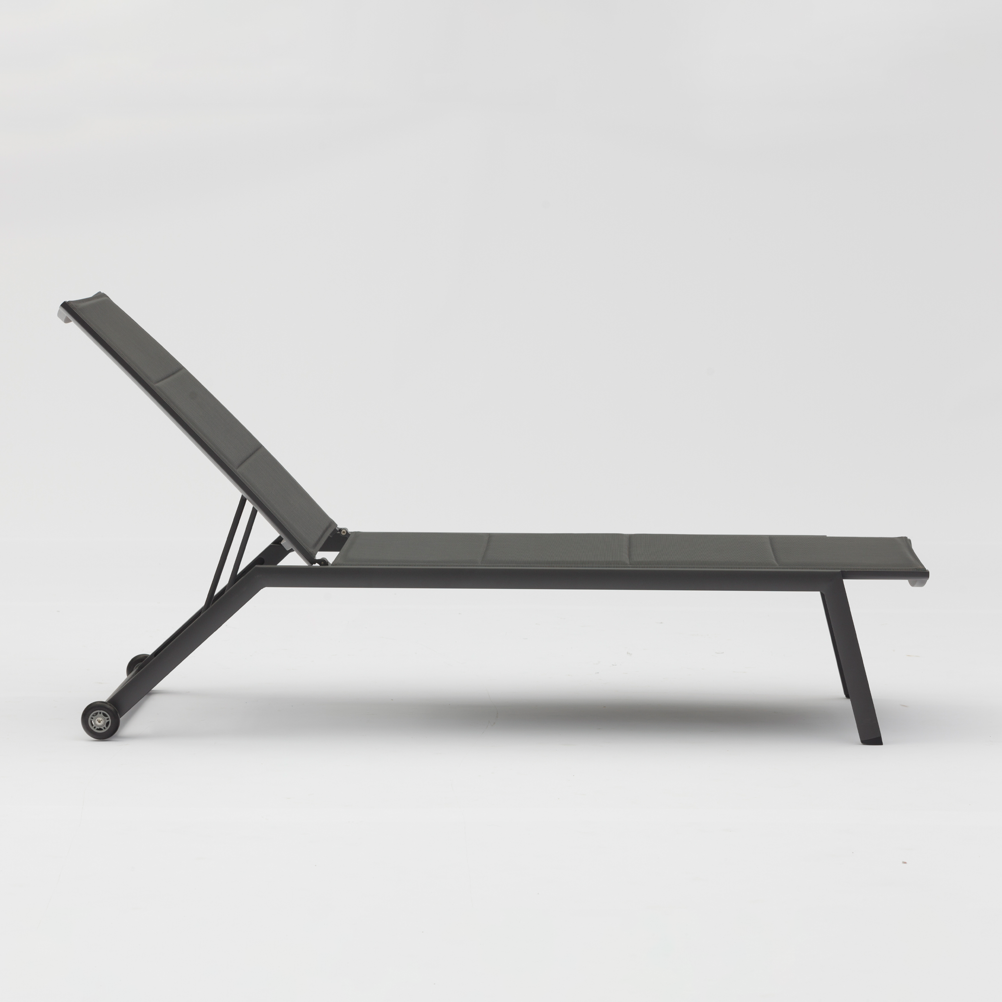 Side view of the Monaco Padded Sunlounger in Charcoal with tear-resistant fabric, featuring an adjustable reclined backrest and wheels on the back legs.