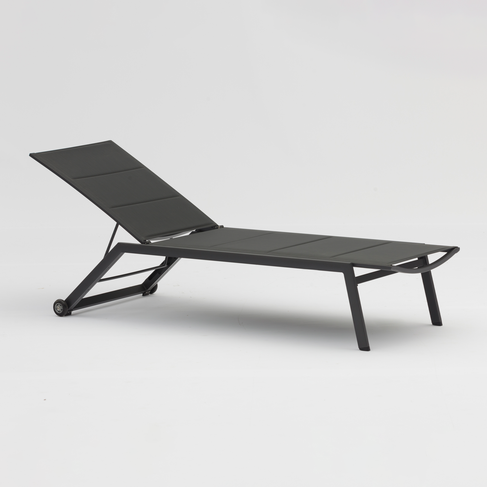 The Monaco Padded Sunlounger in Charcoal is a modern, sleek lounge chair featuring an adjustable backrest and small wheels on the back legs. It's crafted from durable Tiger Drylac aluminium.