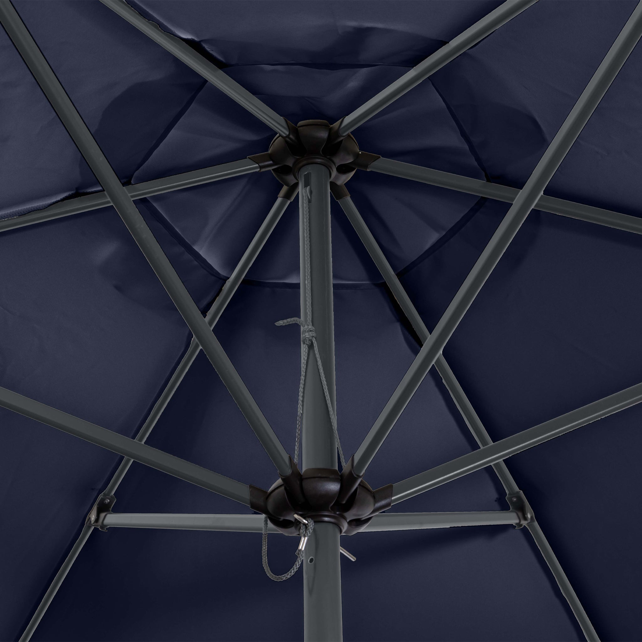 Close-up view of the underside of a Triton 3m Round Aluminium Parasol in Navy, showcasing its sturdy metal frame and support structure. This free-standing parasol boasts a UV rating of 50+, ensuring maximum protection from the sun's harmful rays.