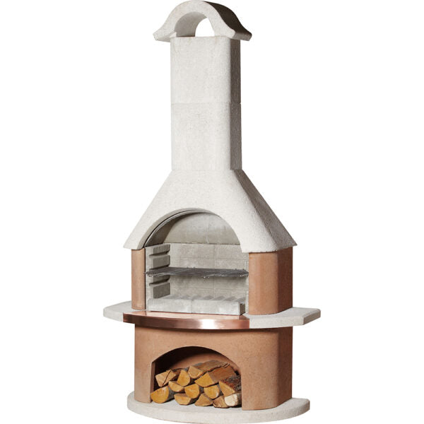 The Buschbeck Bologna Masonry Barbecue boasts a white quartz structure and includes a concrete outdoor fireplace with a tall chimney, metal grill racks, and an underneath storage area for firewood. Its double-skinned construction ensures both durability and high performance.