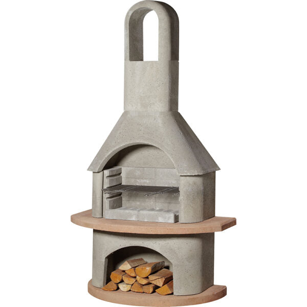 The Buschbeck Carmen Masonry Barbecue boasts a natural grey finish, complete with a chimney, grilling rack, and a convenient firewood storage area underneath.