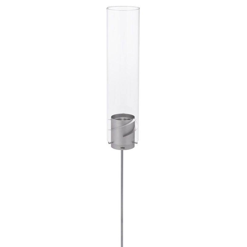 Höfats SPIN Ground Spike grey lamp features a tall, cylindrical glass hurricane lampshade with a metal base and a slender, vertical rod stand—an eye-catching addition for any garden party.