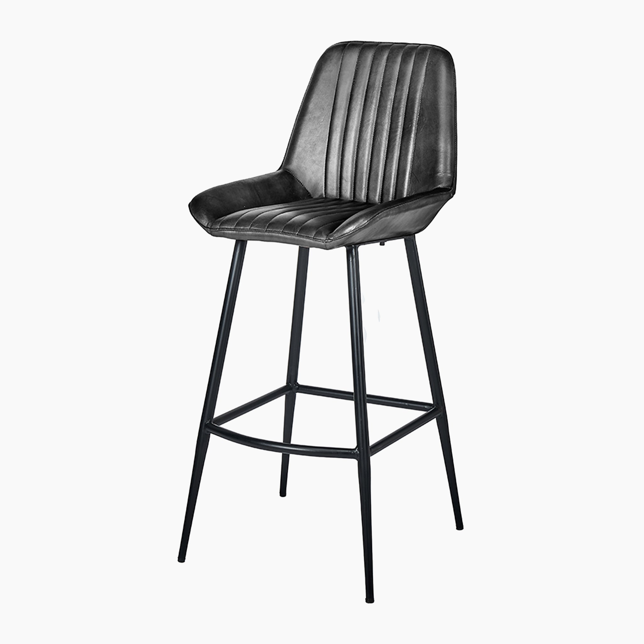 The Pacific Lifestyle Angelo bar stool, in steel grey leather with a ribbed backrest and sturdy iron legs, is perfect for enhancing your kitchen island.