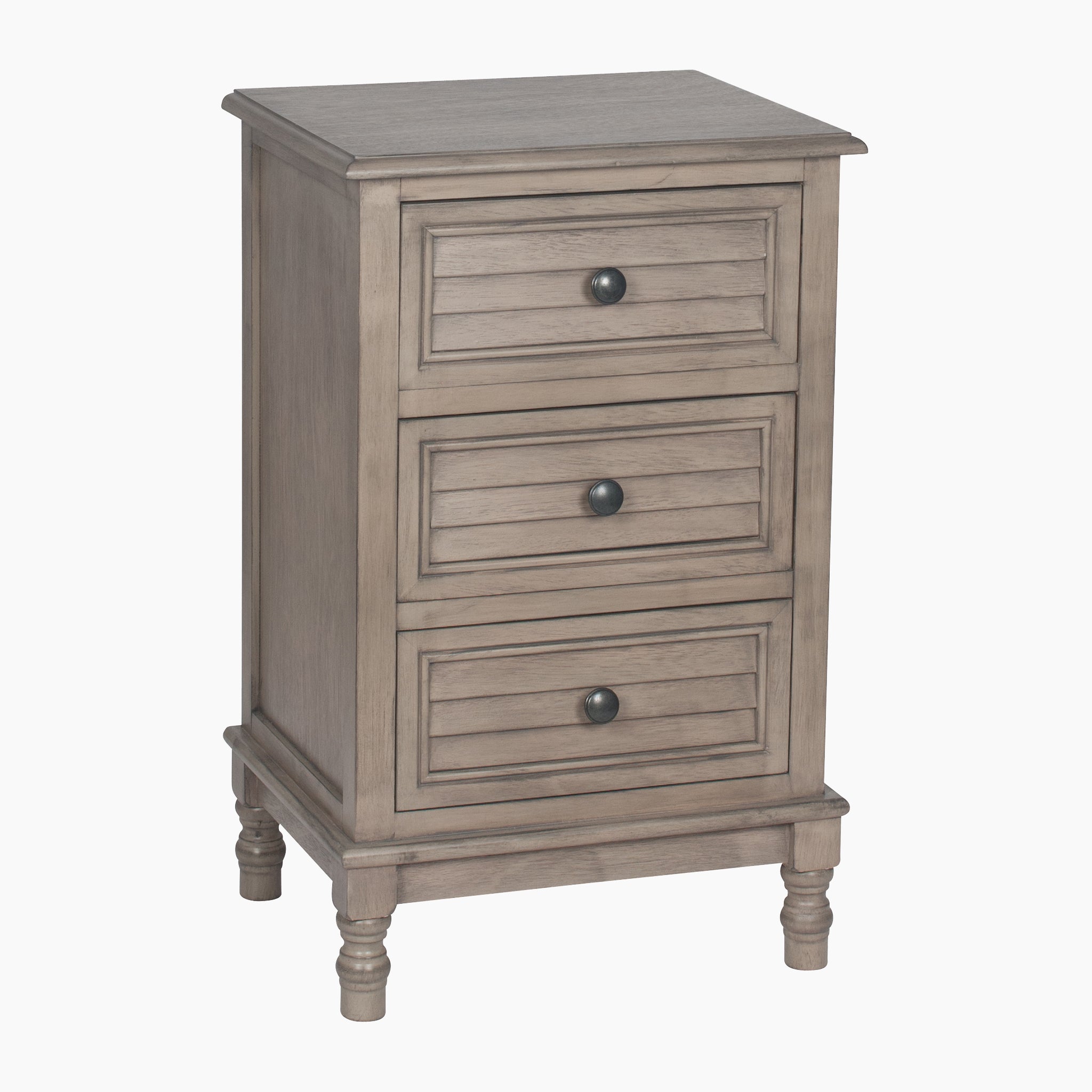 The Pacific Lifestyle - Ashwell Taupe Pine 3 Drawer Wood Unit is a nightstand featuring pine wood construction, round knobs, and decorative legs, all enhanced by a chic taupe finish for subtle elegance.