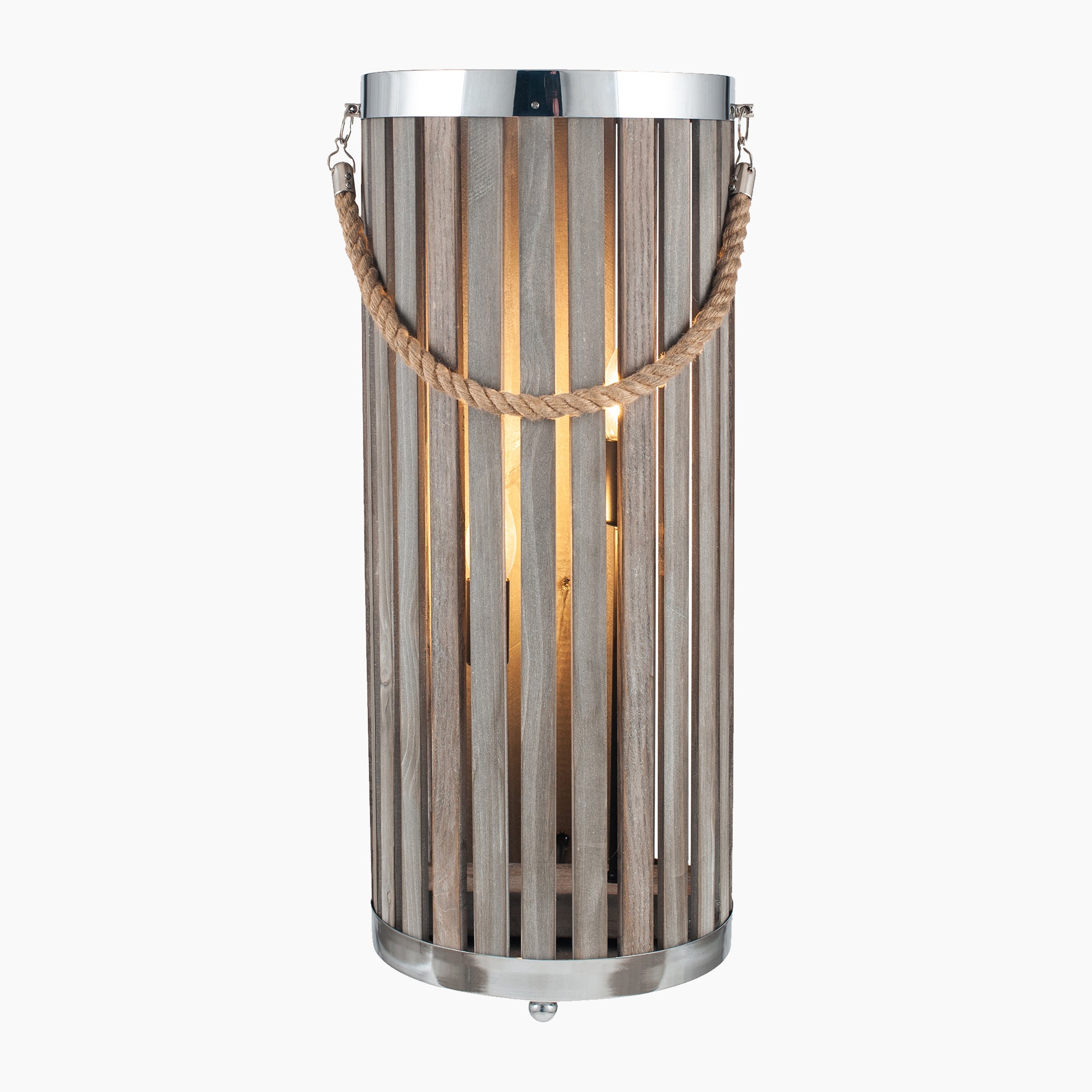 The Austell Grey Wash Wood Lantern Floor Lamp by Pacific Lifestyle features a tall cylindrical shape with coastal styling, wooden slats, a metal top and base, and a rope handle, all lit from within.