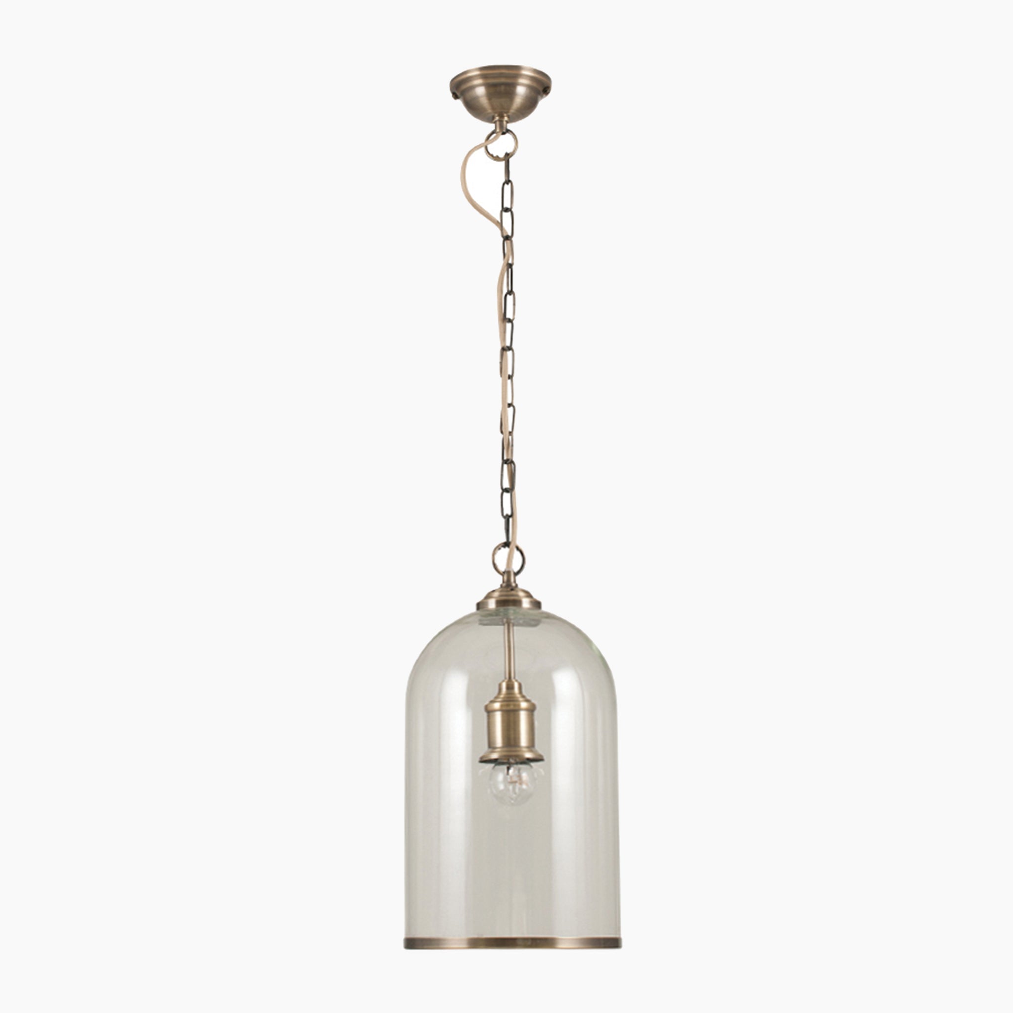 The Pacific Lifestyle Cloche pendant features a clear glass shade with an antique brass rim and a small bulb inside.